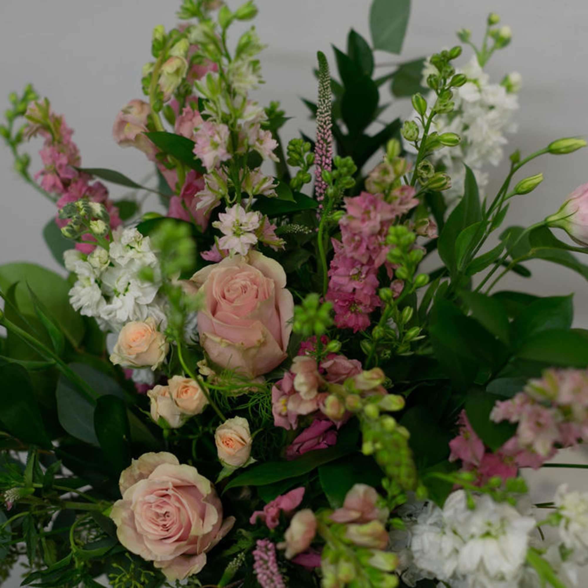 Vintage style floral arrangement in a wooden box.
(frontal facing arrangement)