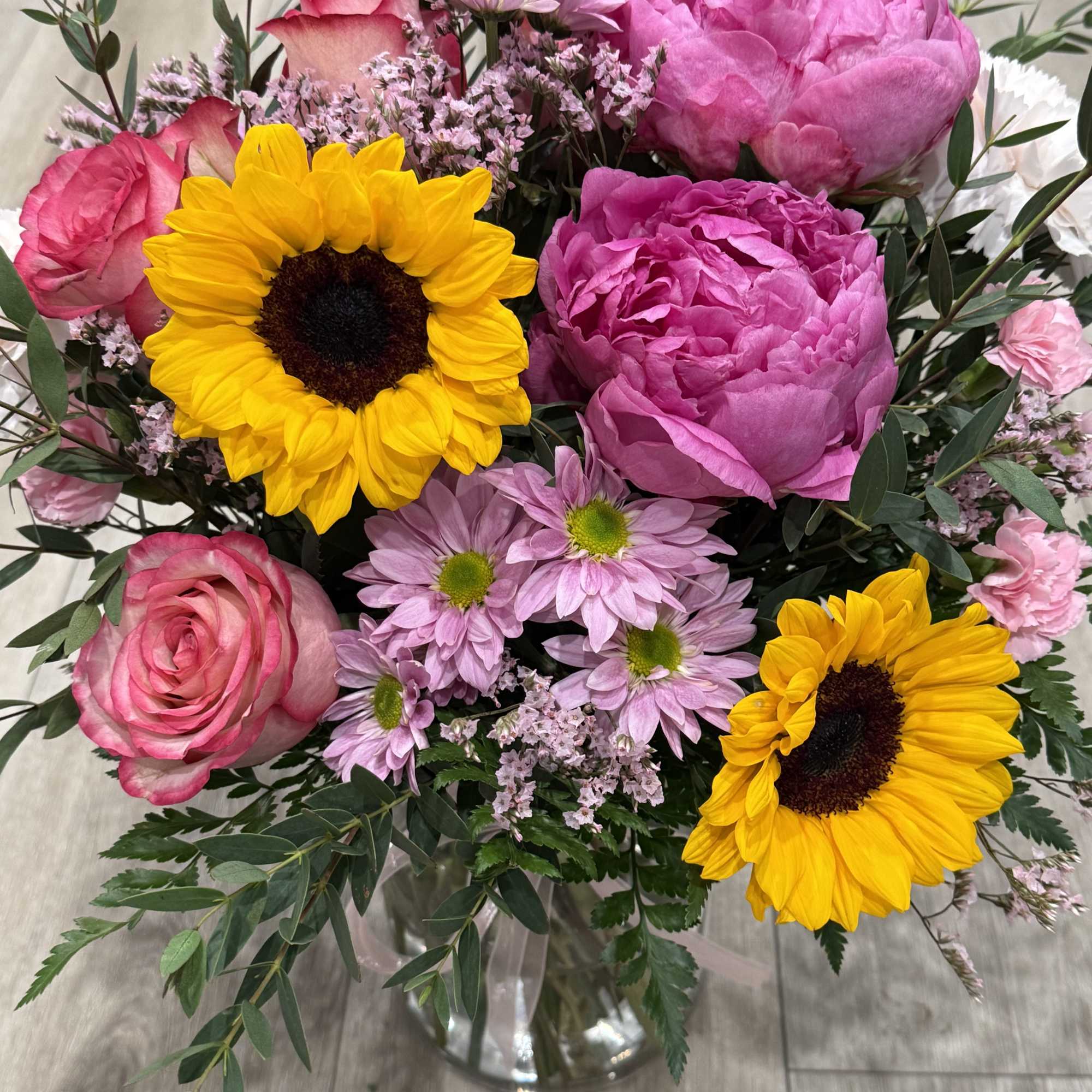 Arrangement includes peonies, roses, carnations and daisies

Celebrate your loved one with a