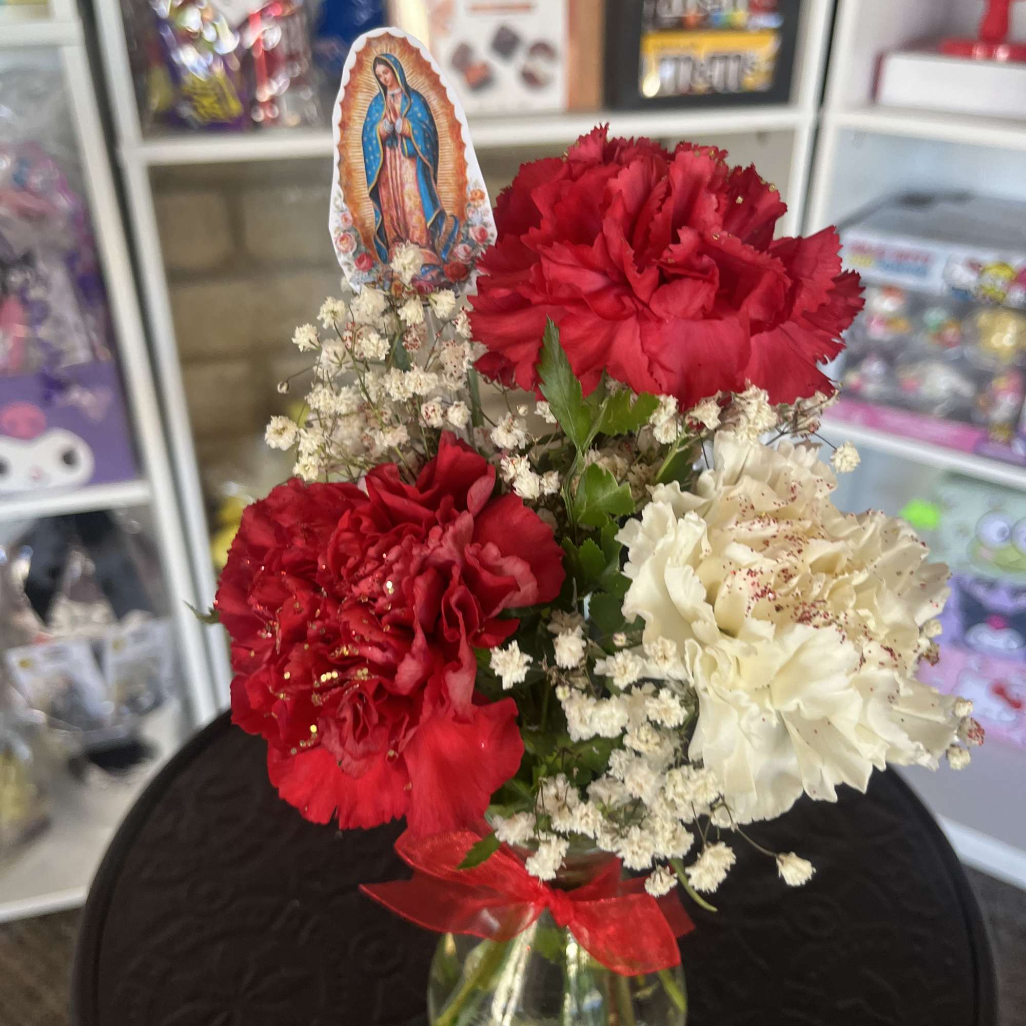 Fresh carnations place in mini bud vase 