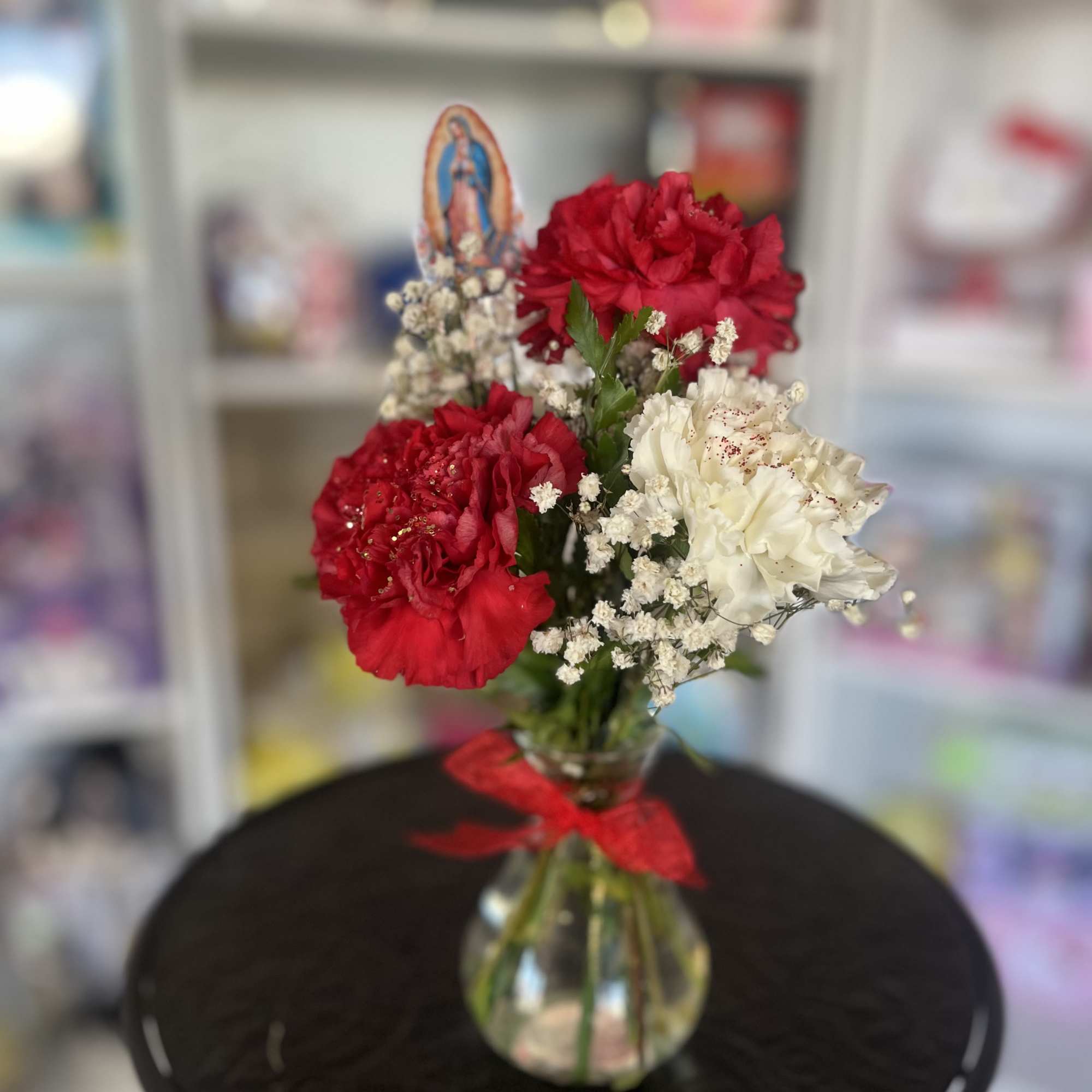 Fresh carnations place in mini bud vase 