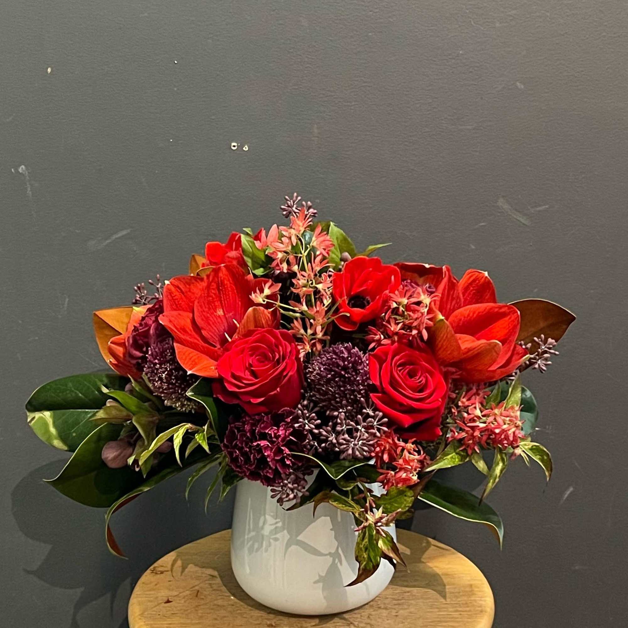 Winter red amaryllis with other Christmas flowers