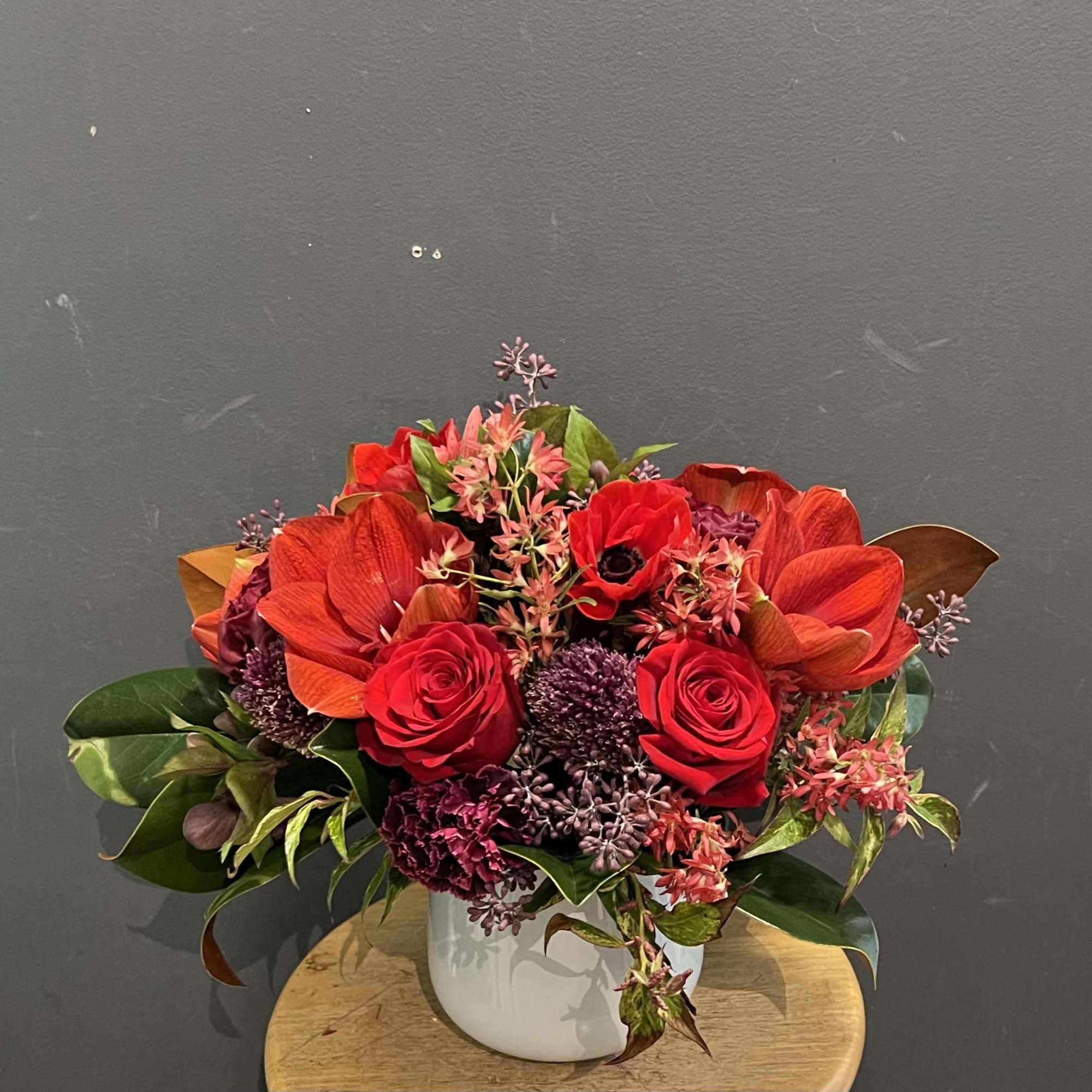 Winter red amaryllis with other Christmas flowers