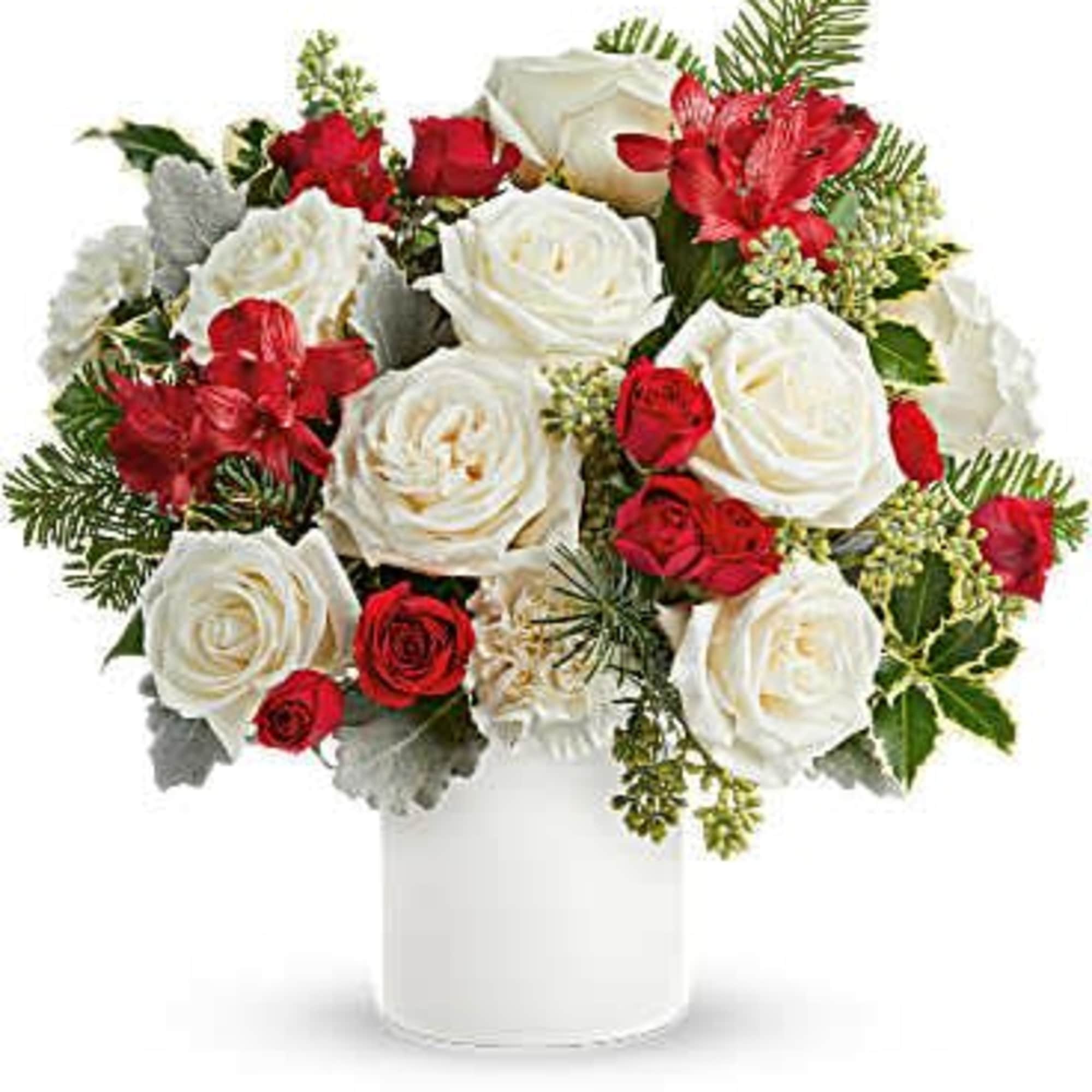 Holiday Joy Bouquet brings seasonal warmth with white roses, red flowers, and