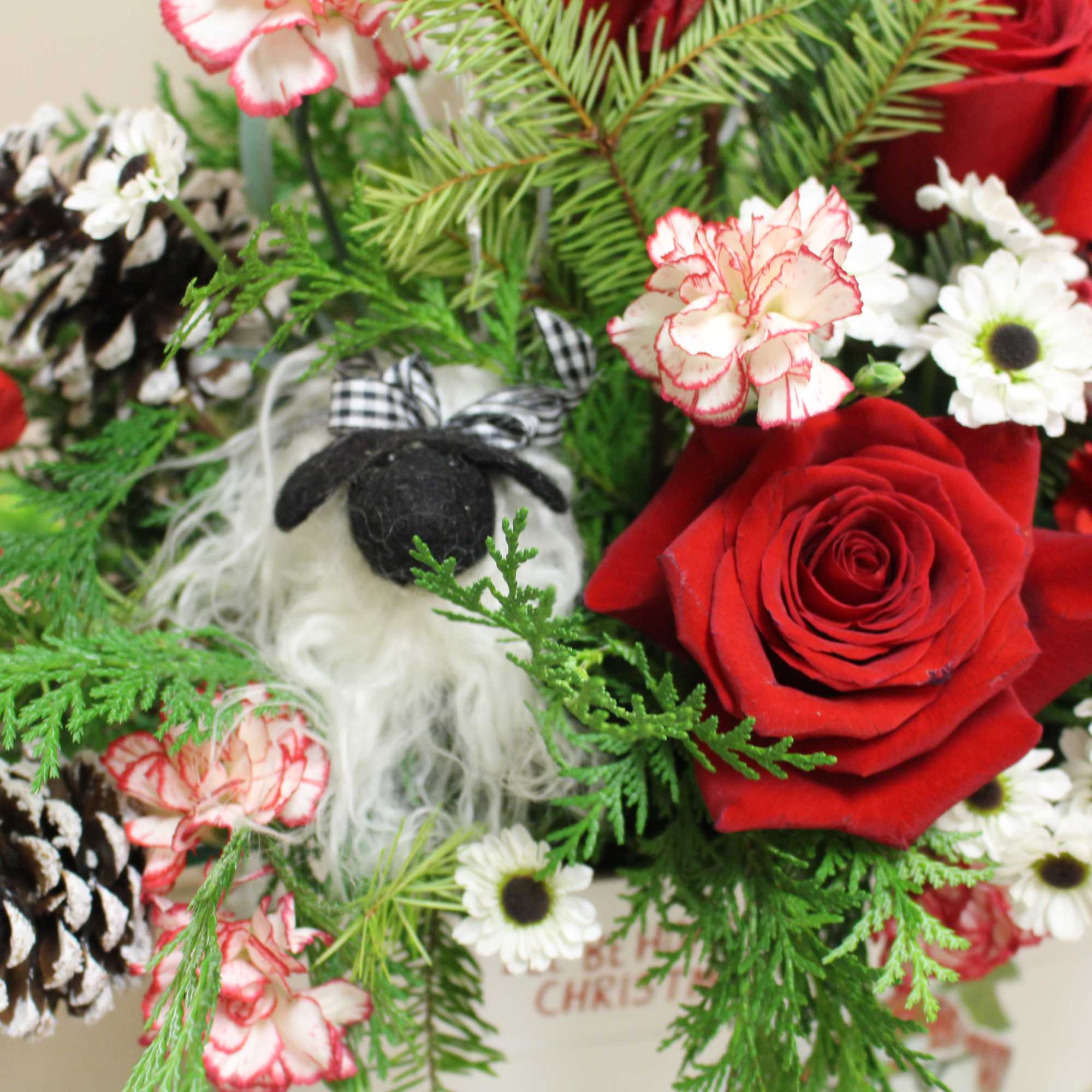 you will see a little lamb peeking thru this beautiful arrangement. 