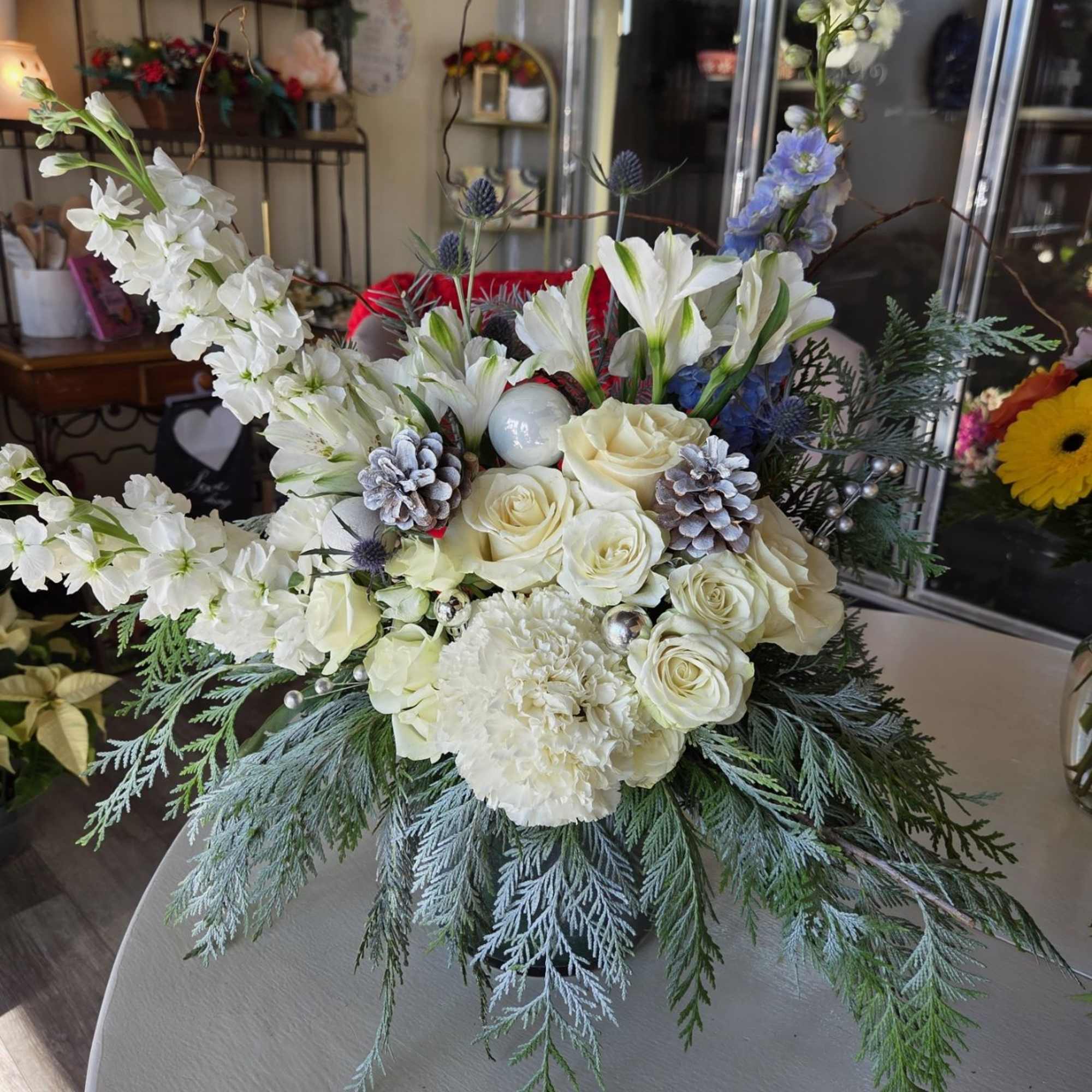 This stunning arrangement features beautiful roses, aromatic stock, hydrangeas and cute touches