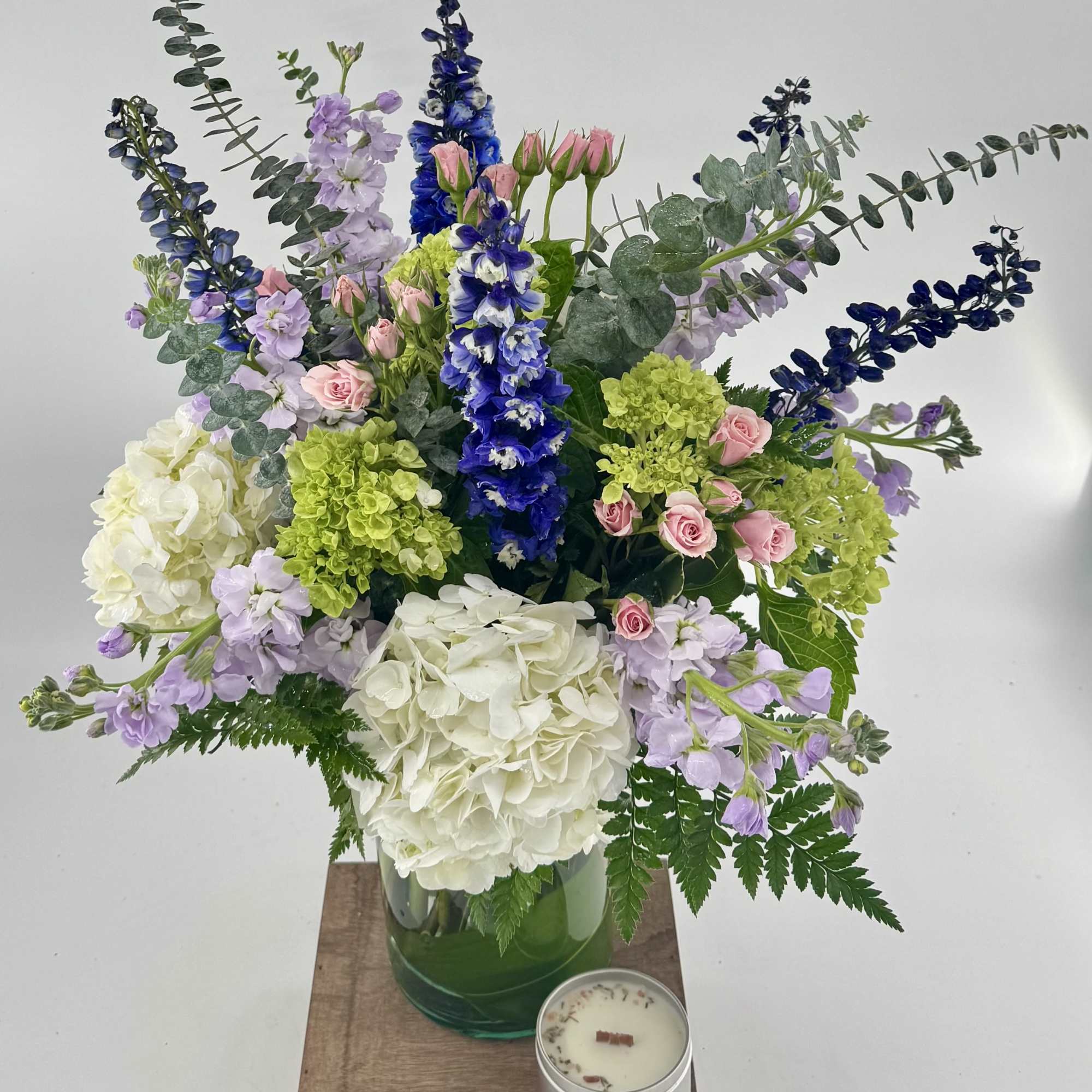 Step into a whimsical realm with our "Tranquil Oasis" floral arrangement, a