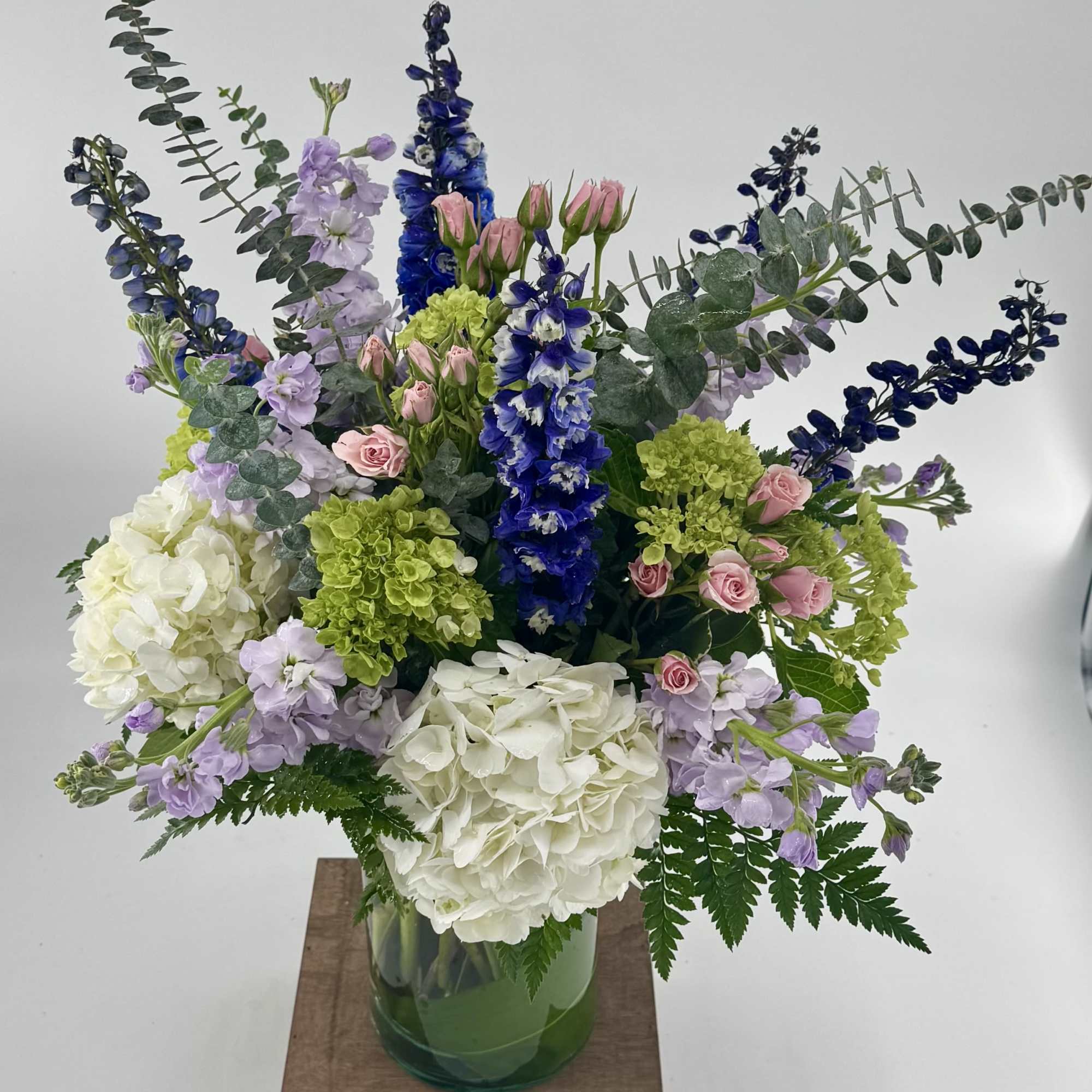 Step into a whimsical realm with our "Tranquil Oasis" floral arrangement, a