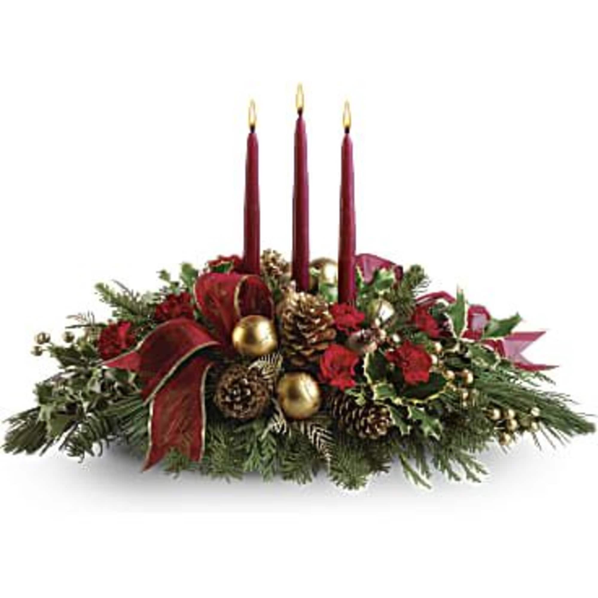 A fresh centerpiece of holly, noble fir, white pine, flat cedar, roses