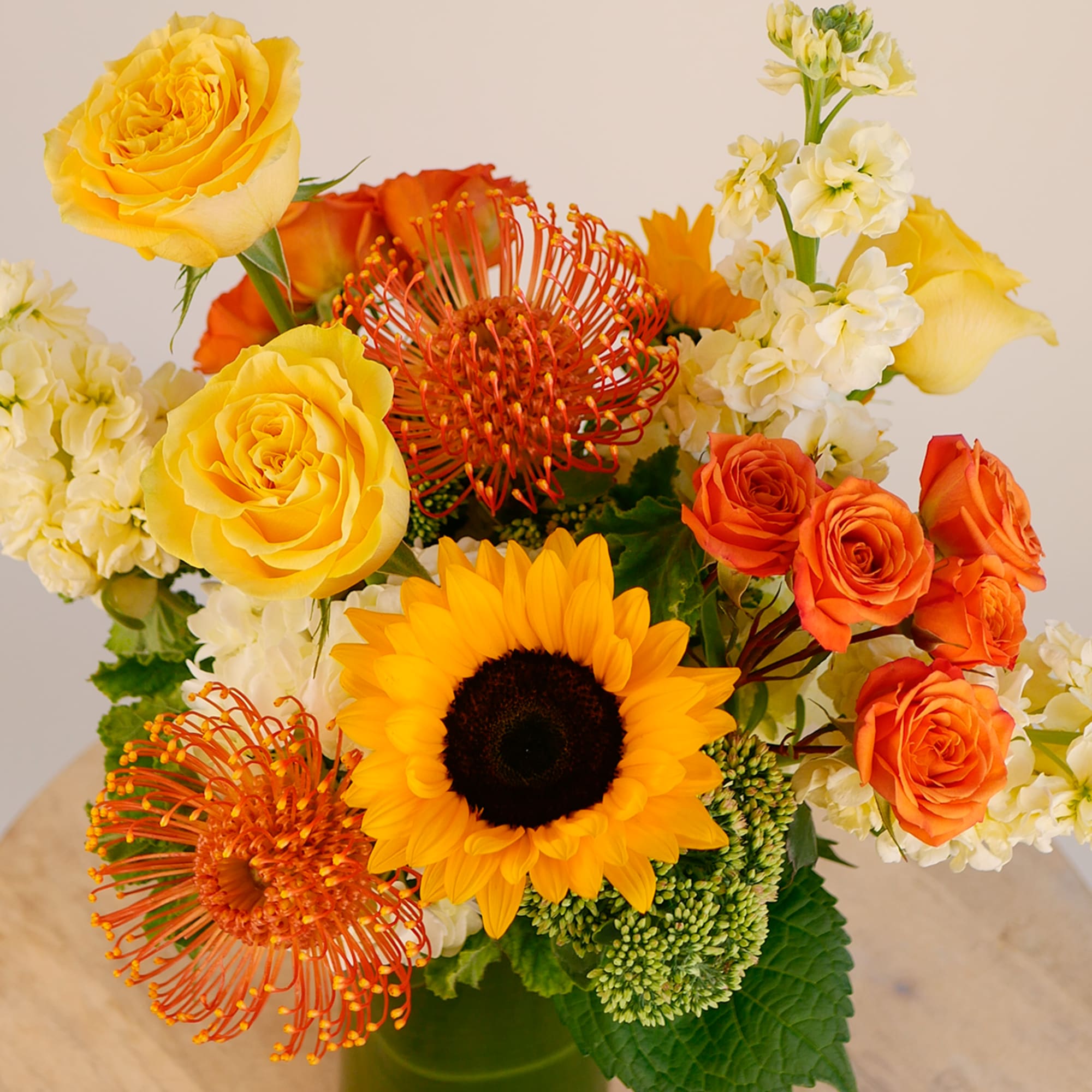 Brighten any space with this radiant mix of sunny yellow roses, bold