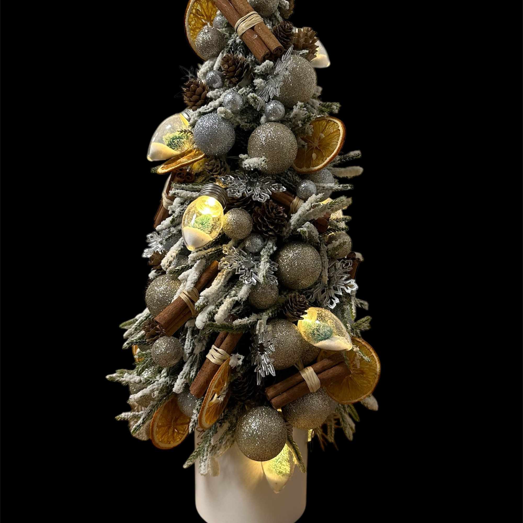 Beautiful Christmas tree with a touch of dried oranges and a hint