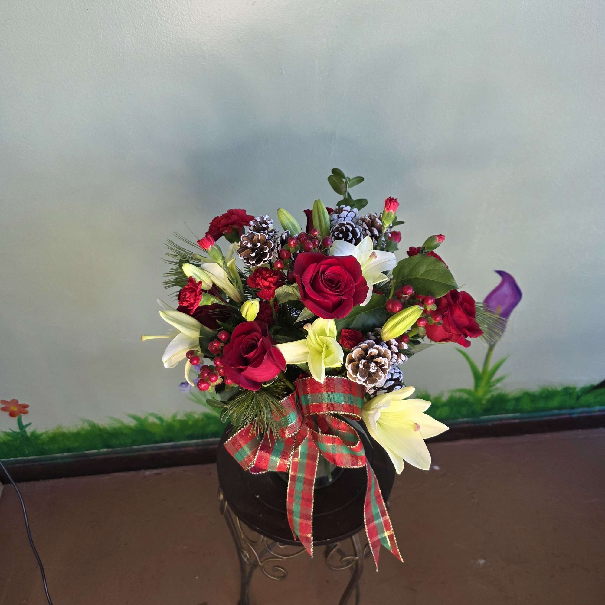 Winter Rose Celebration is a festive and elegant holiday arrangement featuring rich