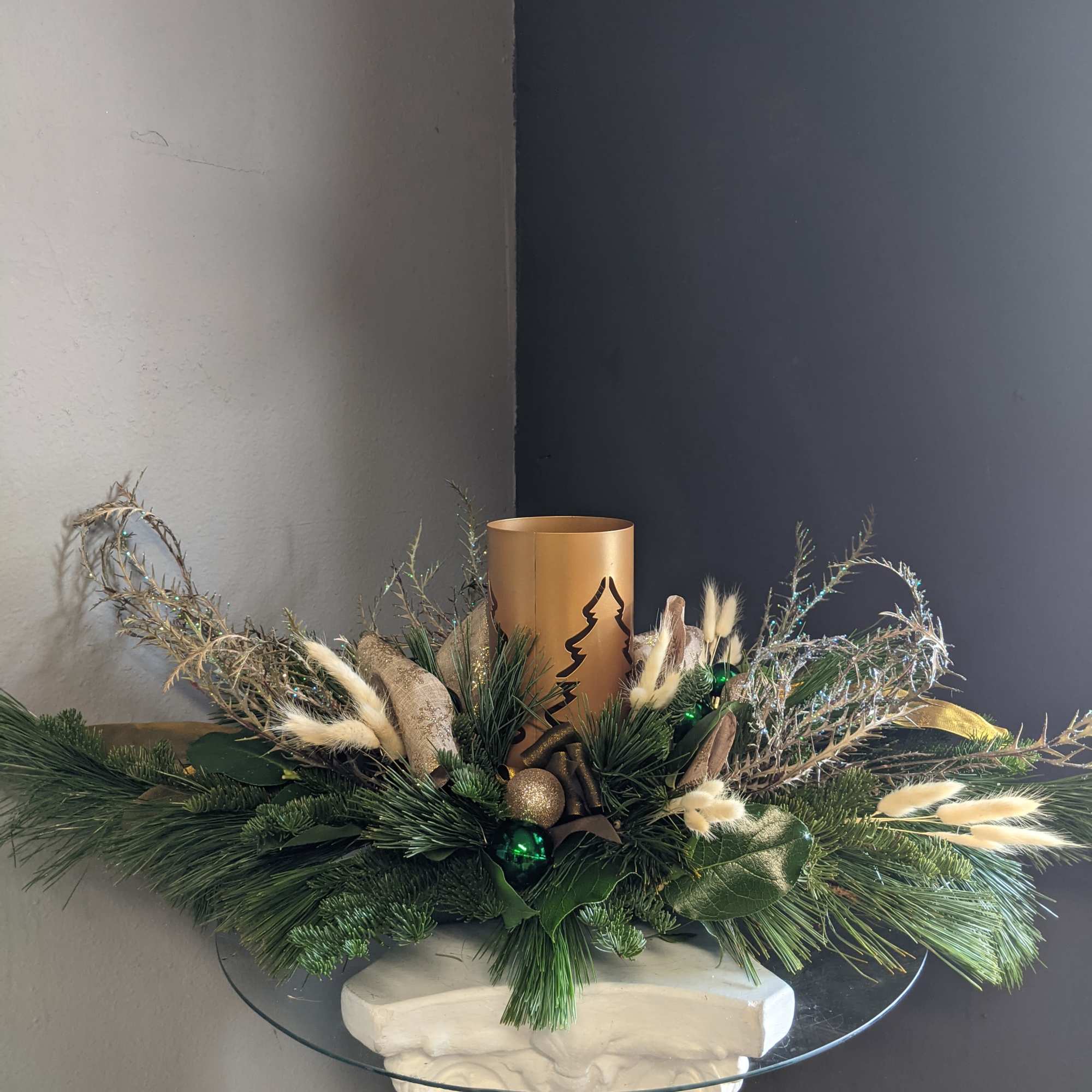 Festive all holiday green table centerpiece with. No flower so this beauty