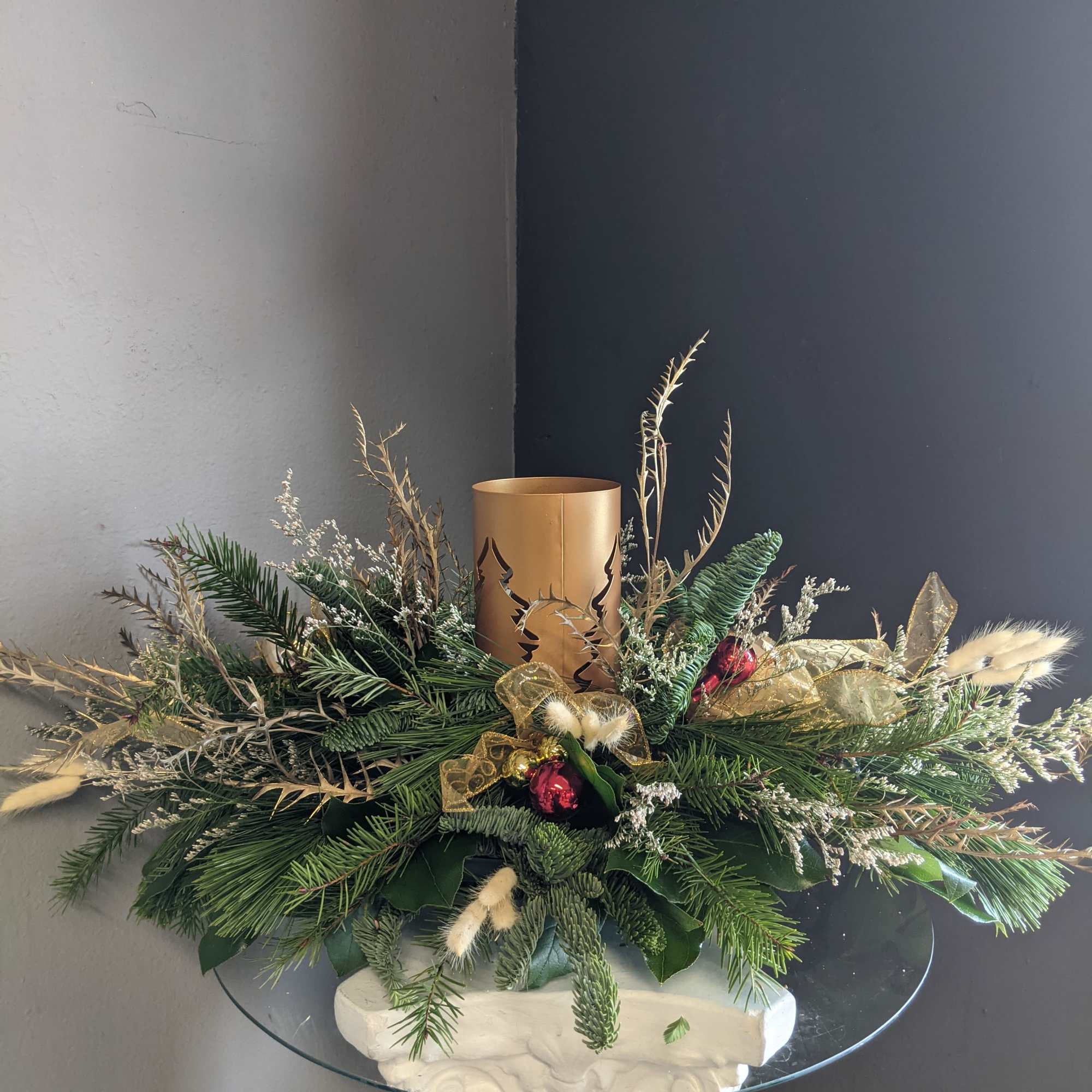 Festive all holiday green table centerpiece with. No flower so this beauty