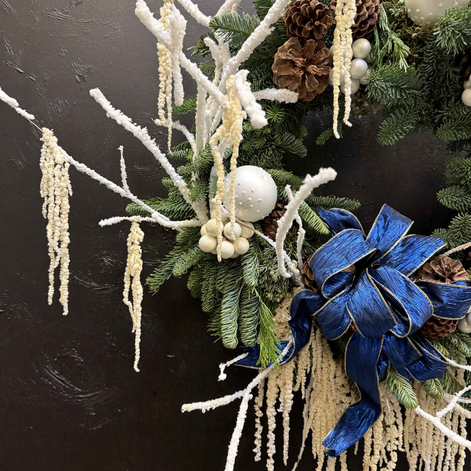 The Winter Pearl Elegance Wreath is a fresh, handcrafted Christmas wreath made