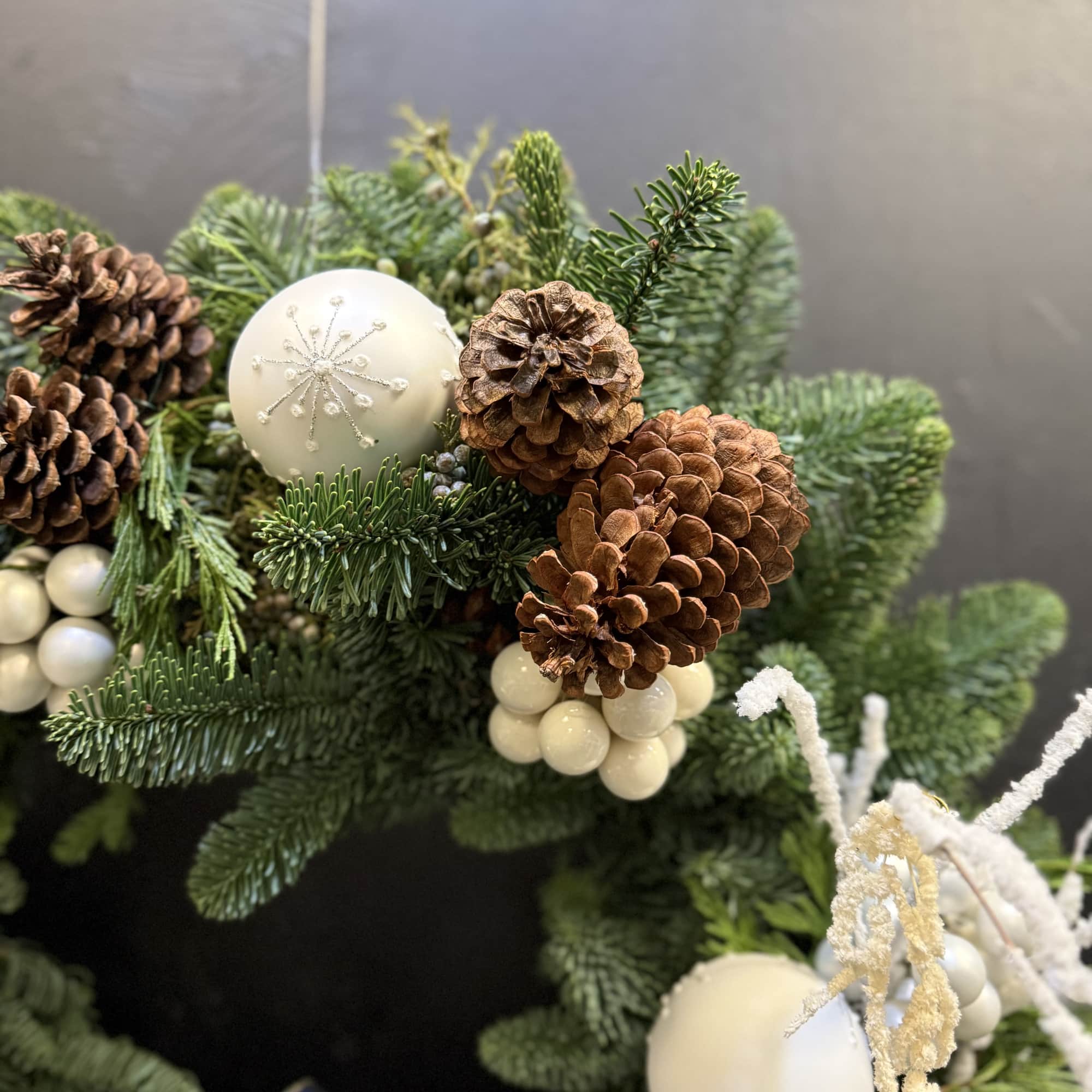 The Winter Pearl Elegance Wreath is a fresh, handcrafted Christmas wreath made
