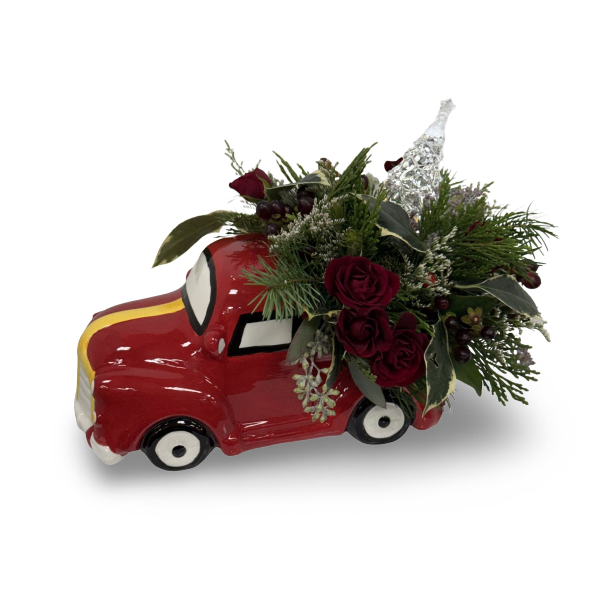 A festive holiday arrangement of deep red roses, winter greens, berries, and