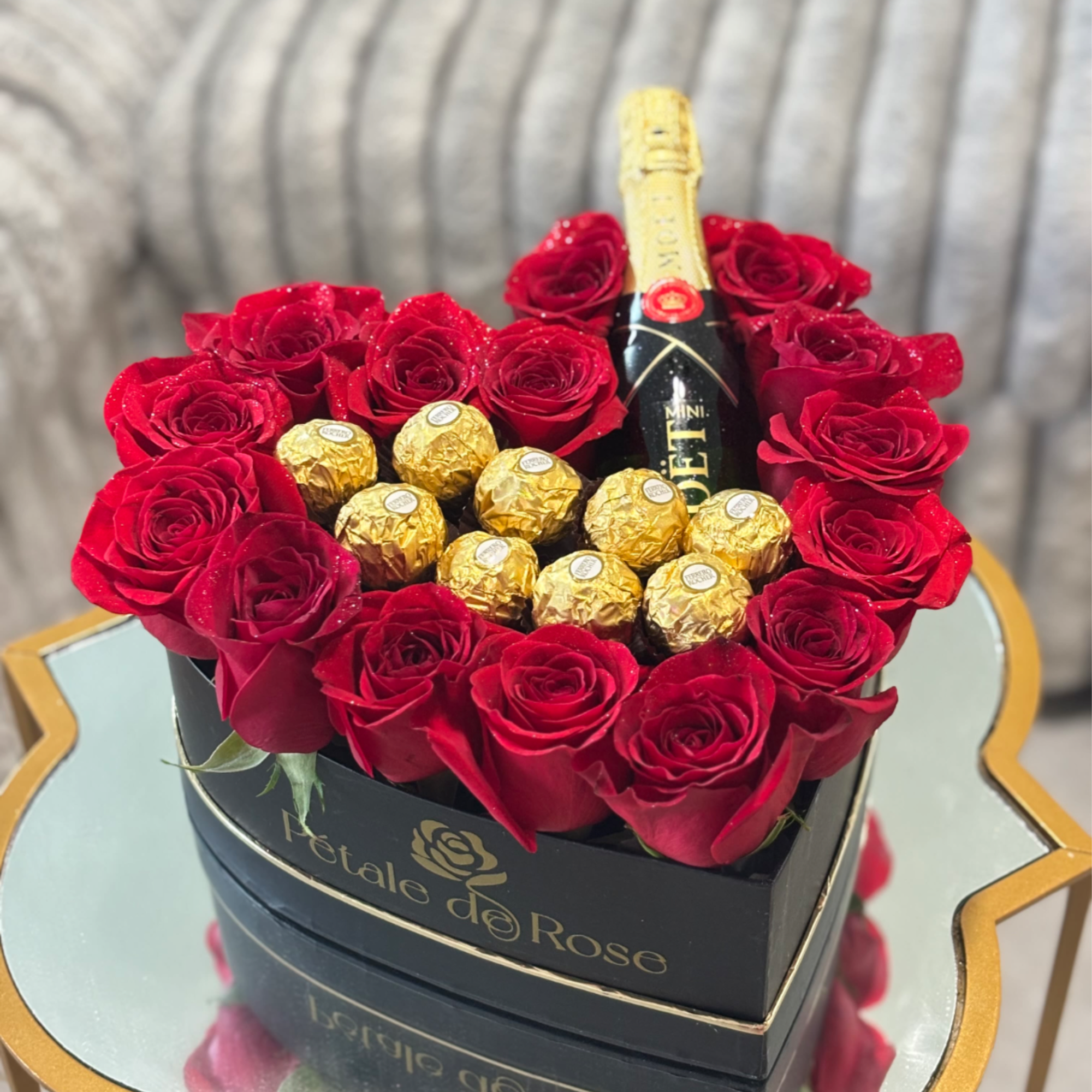 Mini Mo&euml;t combined with red roses and chocolates ferreros , perfect to