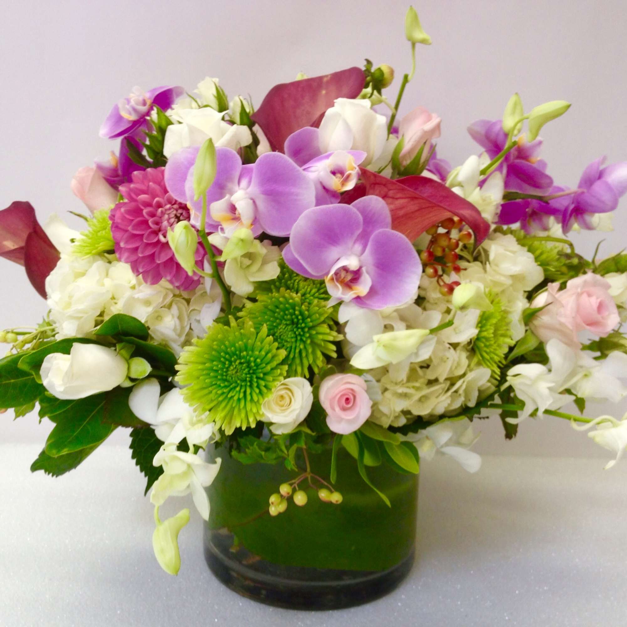 A graceful and timeless arrangement, this design features a beautiful combination of