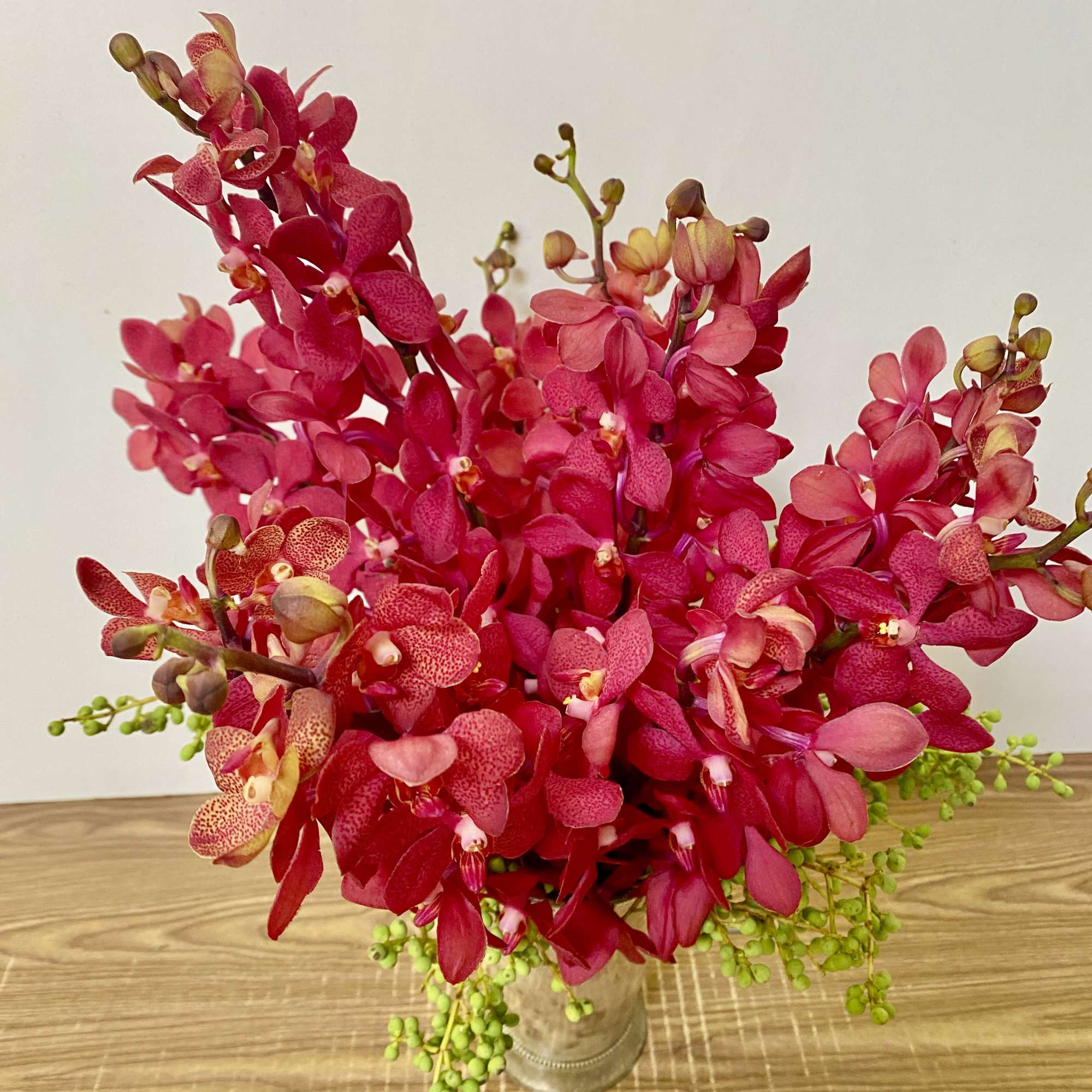 in a clear glass vase 10 stems of Mocara orchids 
Stay almost