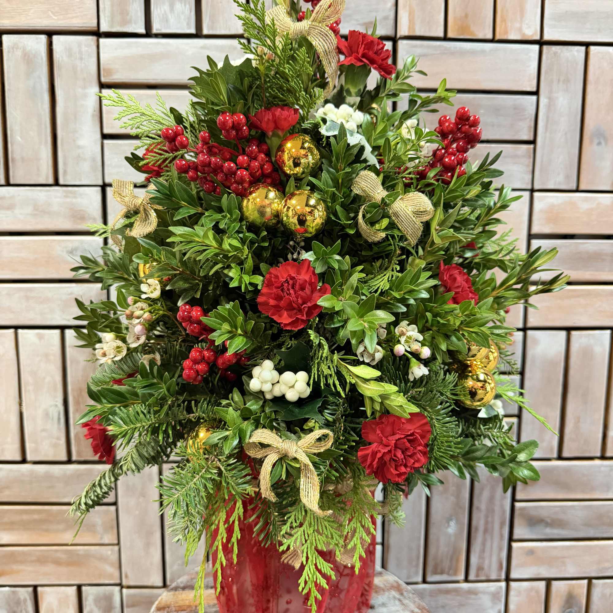 This Regal Holiday Tree is crafted with fresh evergreens, rich red roses