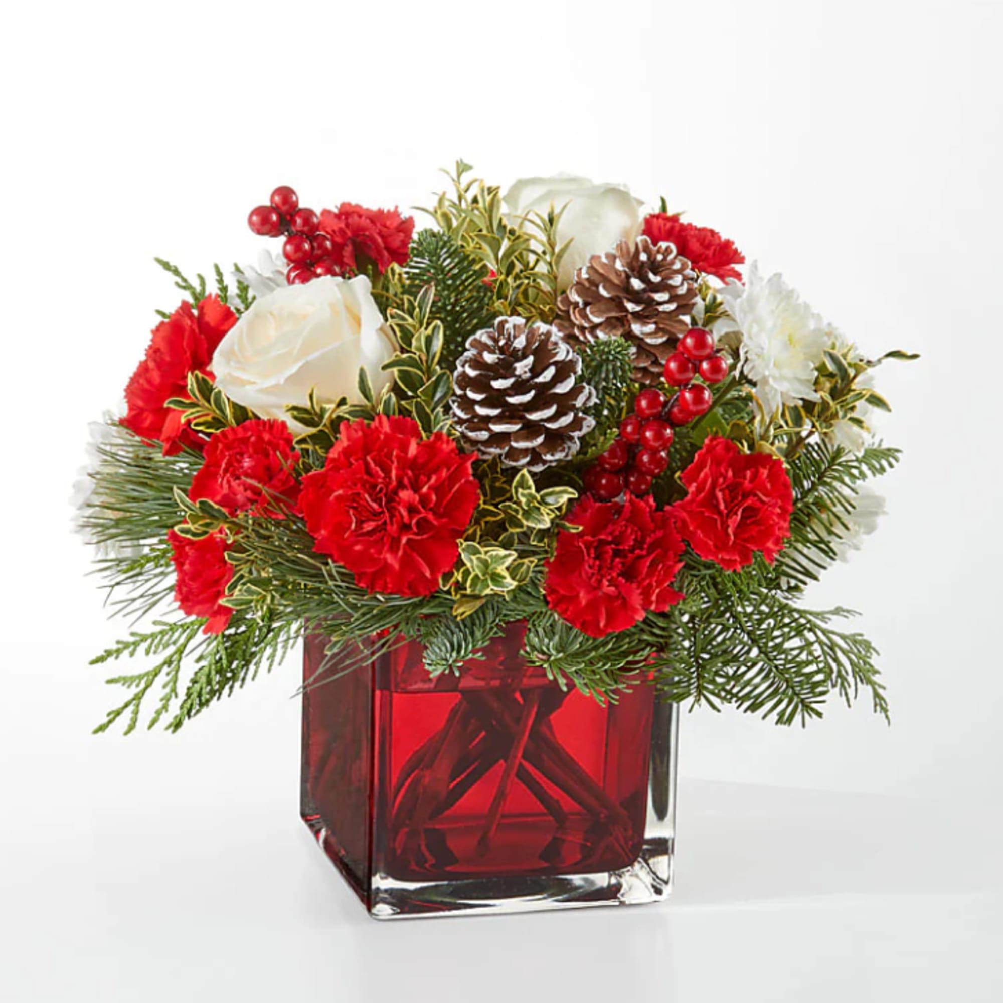 An aromatic experiece, the Christmas Market Bouquet includes assorted seasonal greens to
