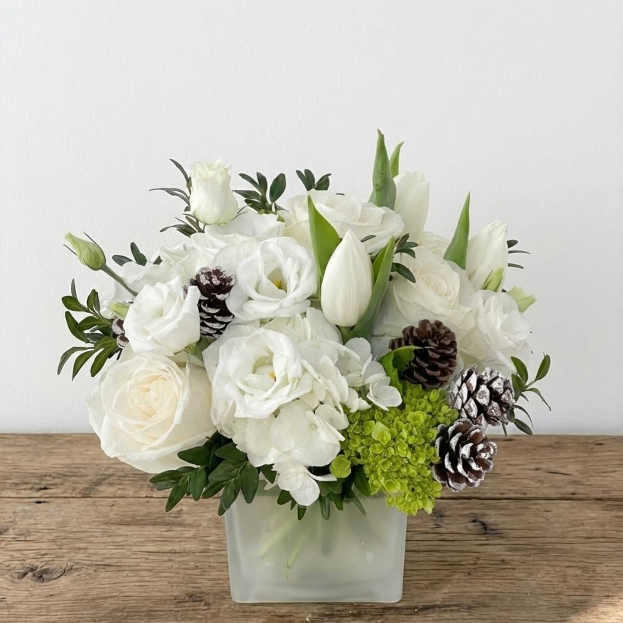 Soft, elegant, and beautifully serene, Snowy is a winter-inspired arrangement that captures