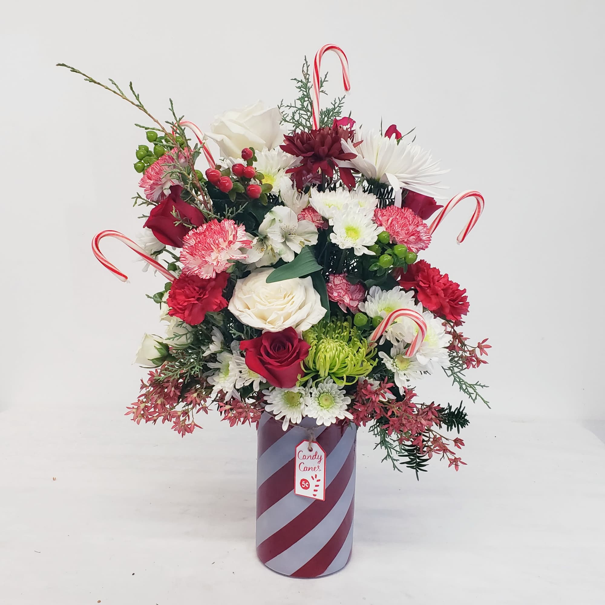 A delicious bouquet bursting with holiday spirit! Approximate overall height 24", in