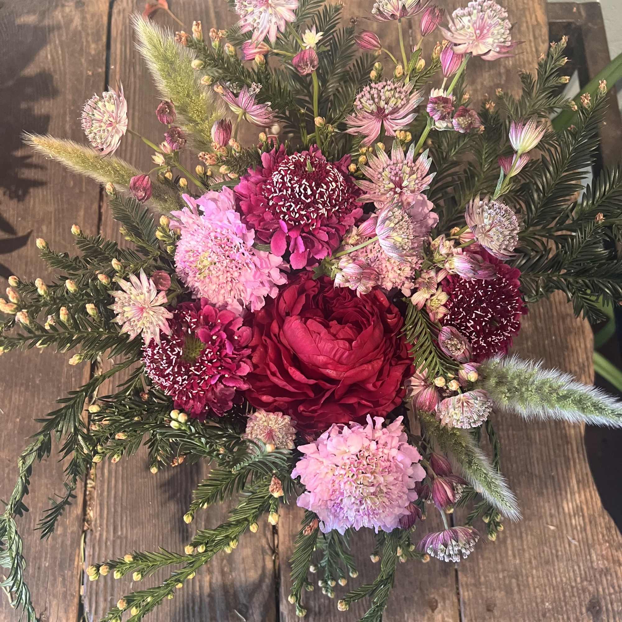 

A darling mix of blush pinks, a bold red bloom, and playful