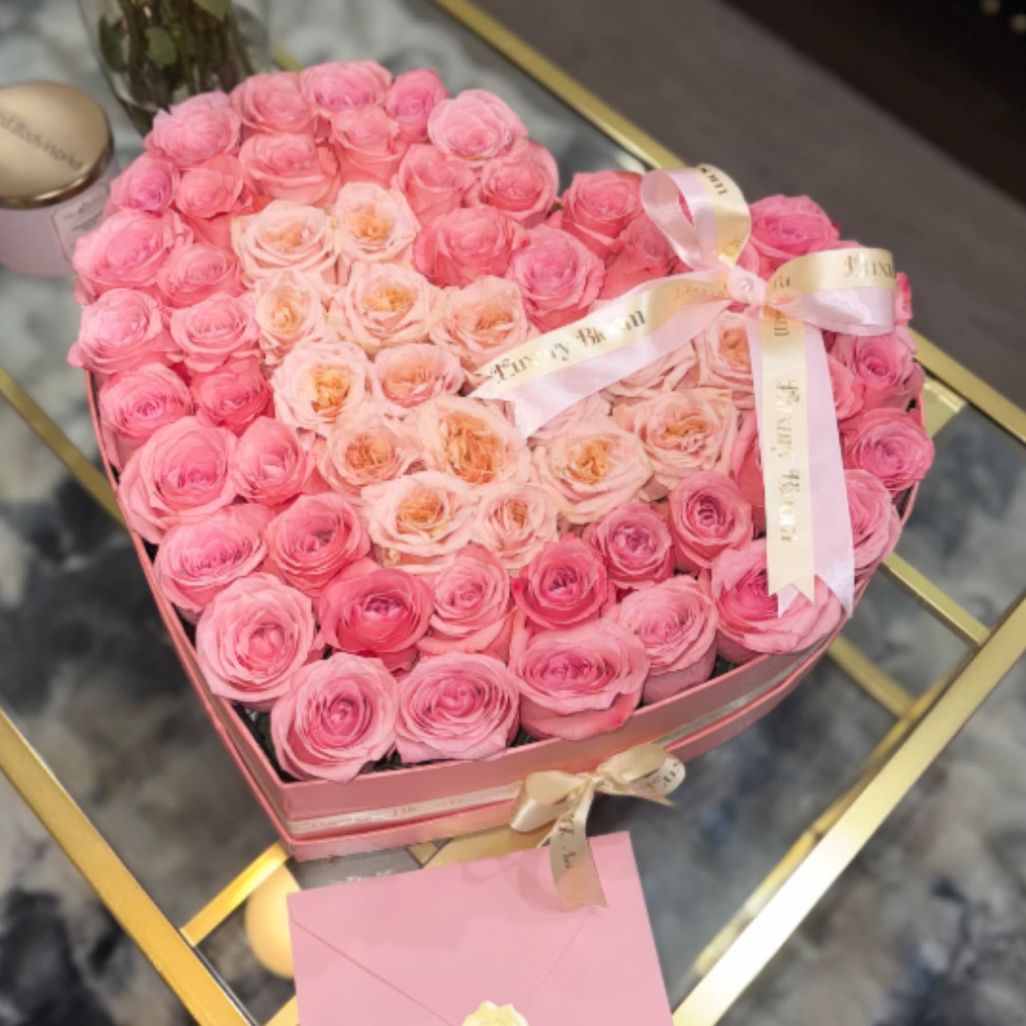 A sophisticated heart-shaped design crafted with 75 fresh, carefully selected roses and