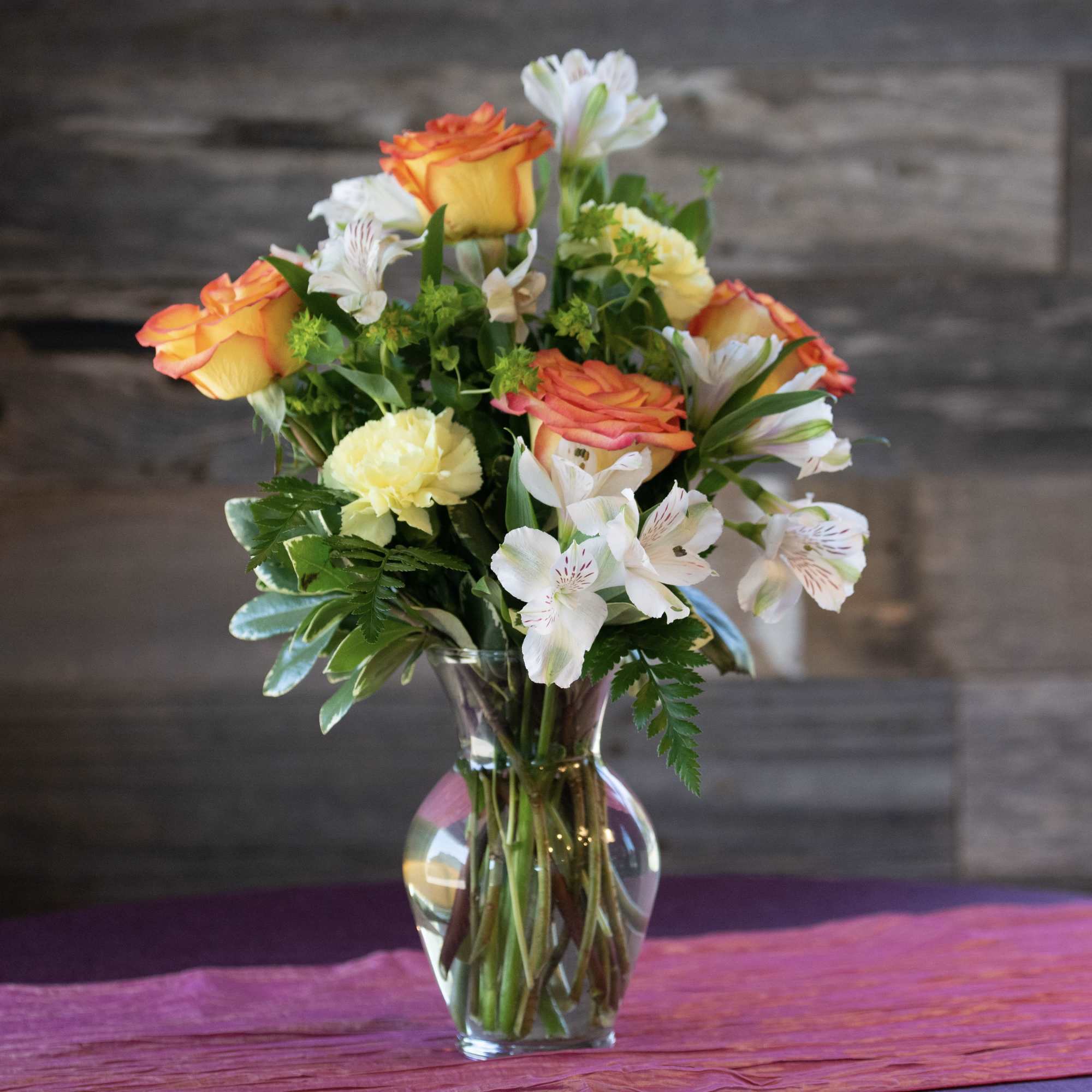   Roses, alstroemeria, and carnations  with trendy greenery.  

We