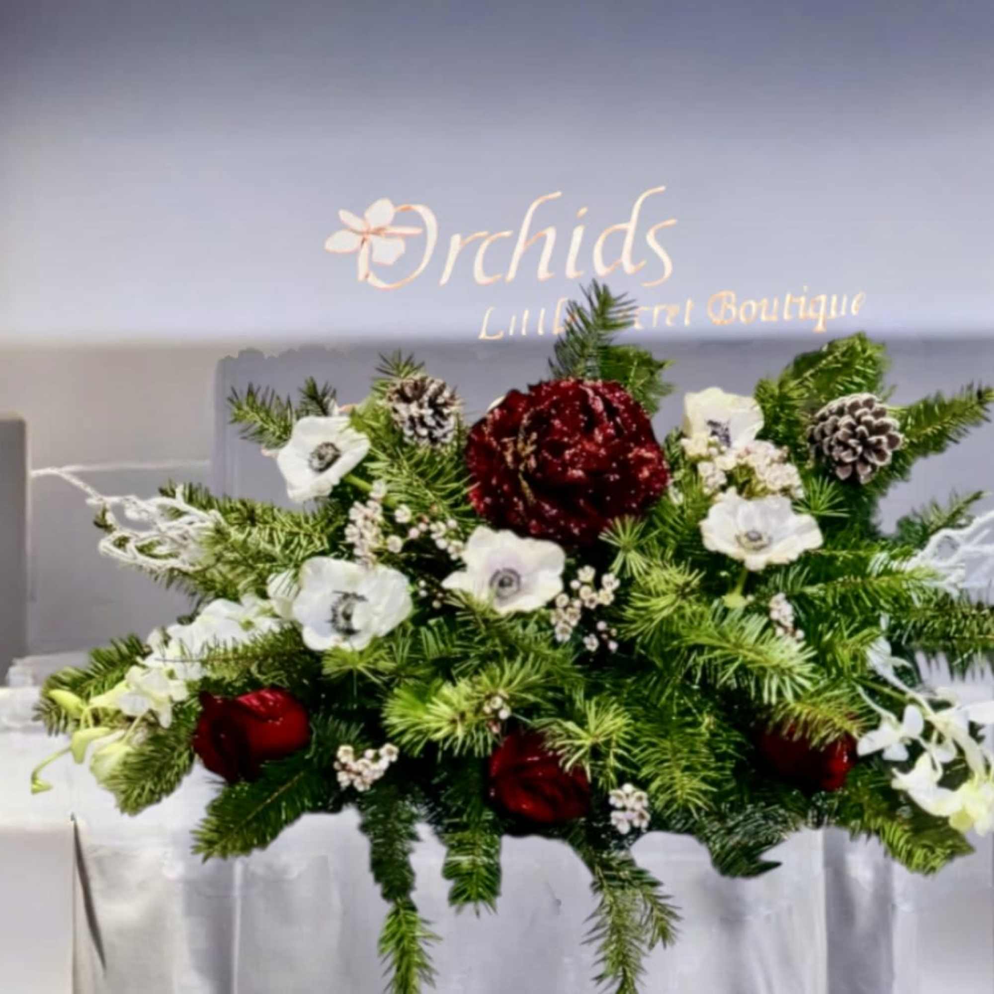 Arrangement measures approximately 8"H x 13"W
Introduce an elegant and timeless holiday centerpiece