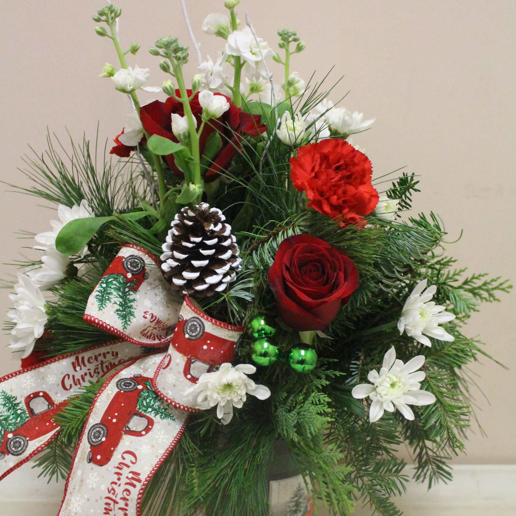  Seasonal arrangement in a vintage container featuring an old-fashioned truck filled