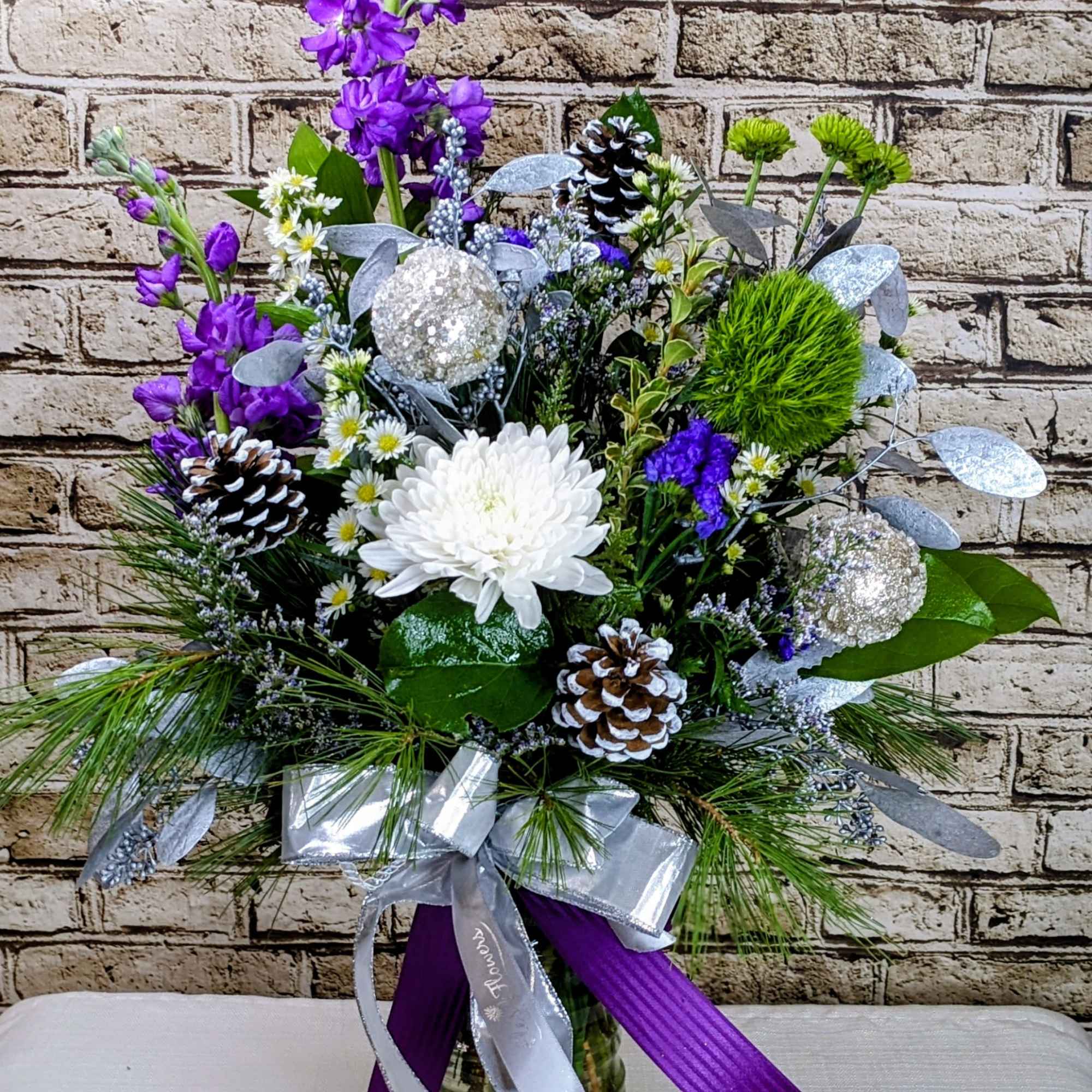 Step into a winter wonderland with Amethyst Winter, a show-stopping floral arrangement