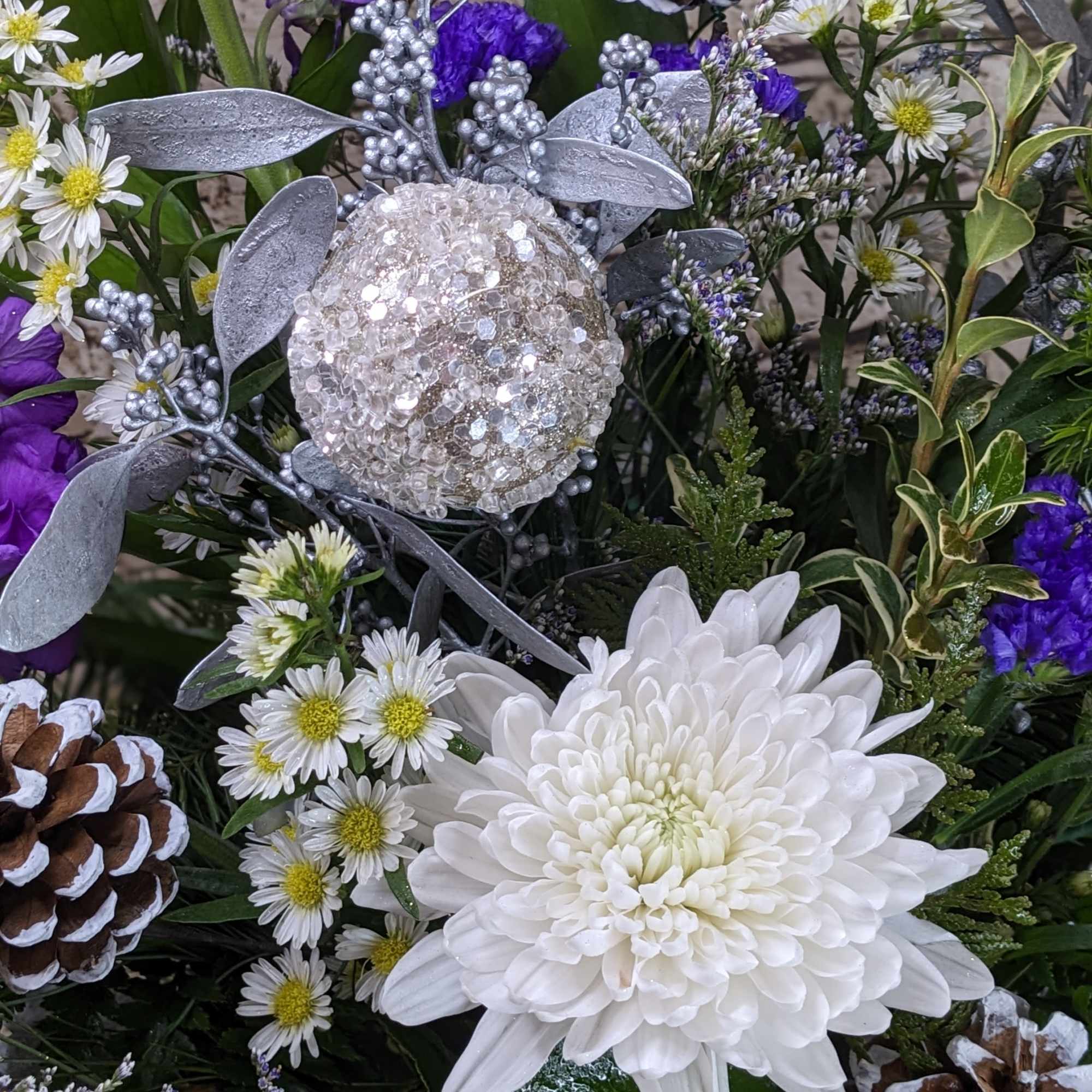 Step into a winter wonderland with Amethyst Winter, a show-stopping floral arrangement