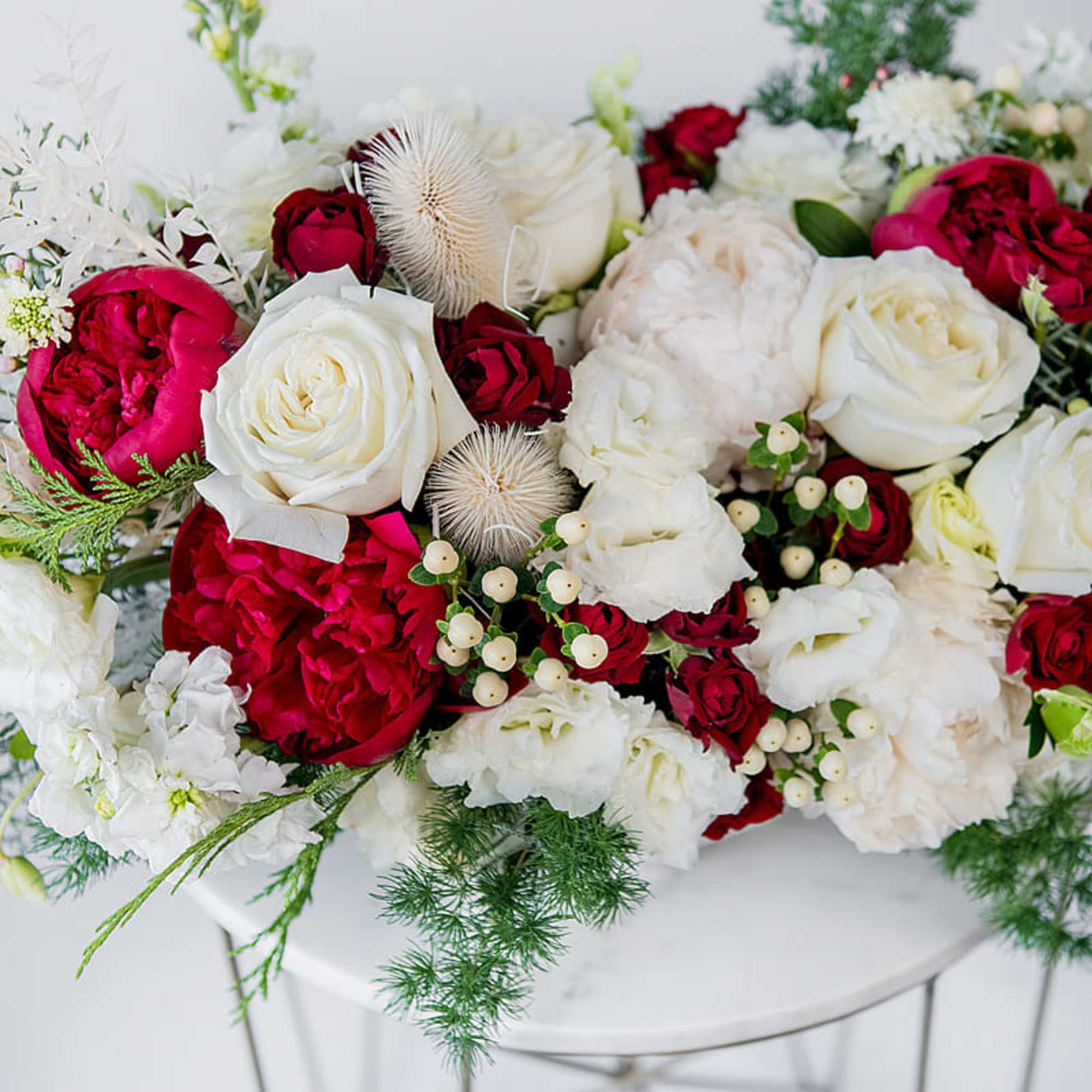 Celebrate the season with our Home for the Holidays arrangement, a lush