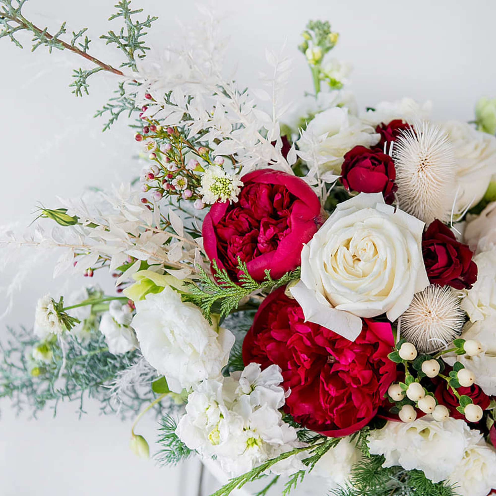 Celebrate the season with our Home for the Holidays arrangement, a lush