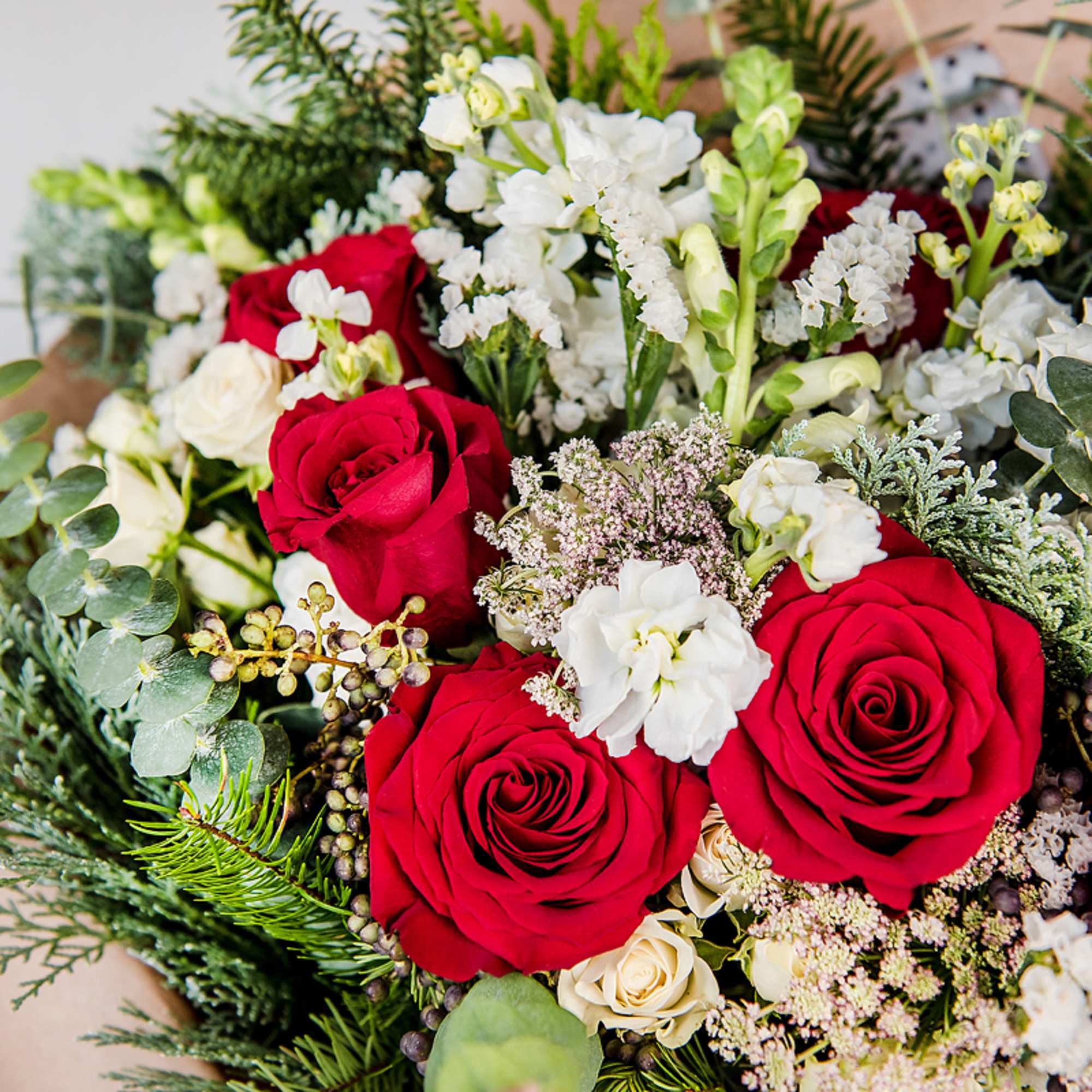 Celebrate the season with our Seasonal Holiday Bouquet, a lush arrangement of