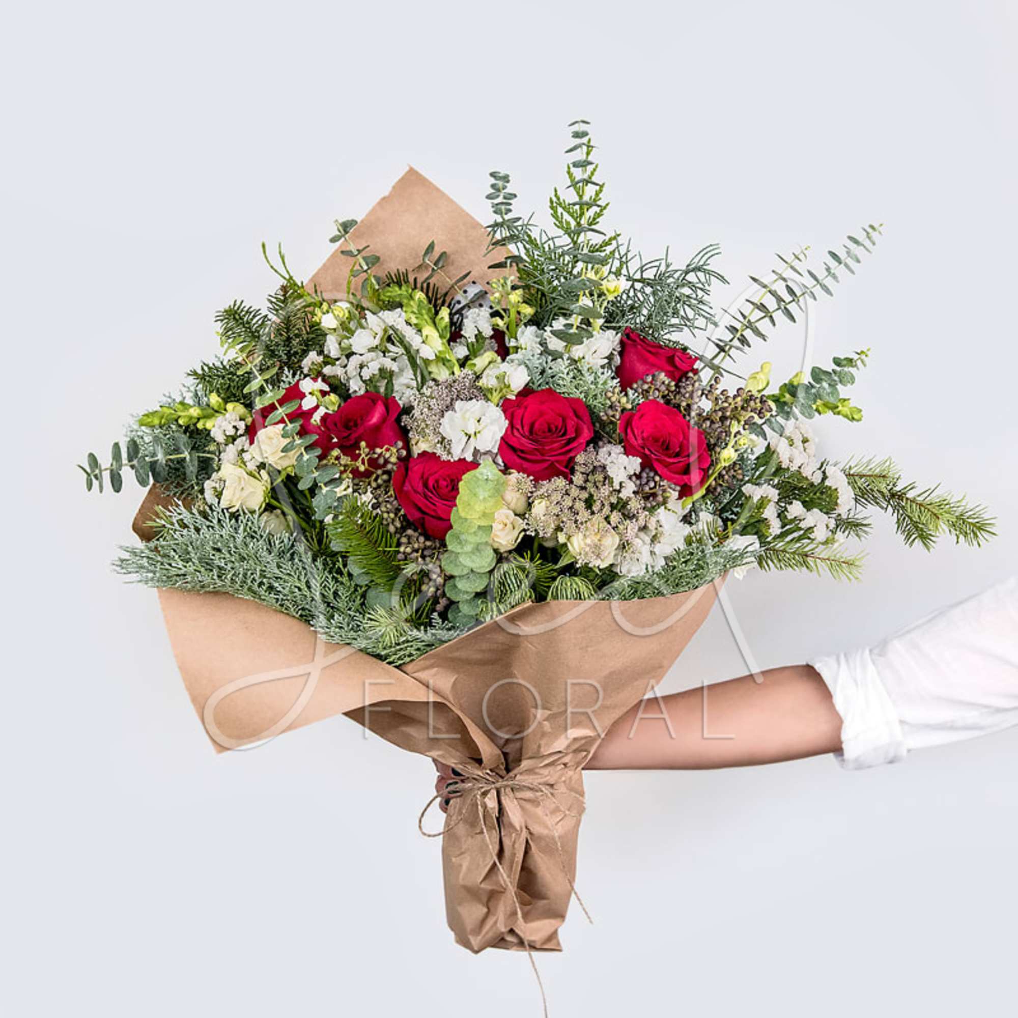 Celebrate the season with our Seasonal Holiday Bouquet, a lush arrangement of