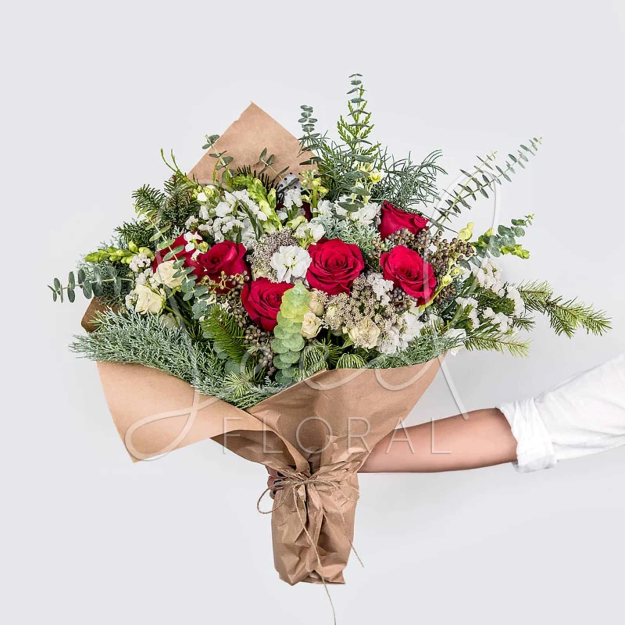 Celebrate the season with our Seasonal Holiday Bouquet, a lush arrangement of