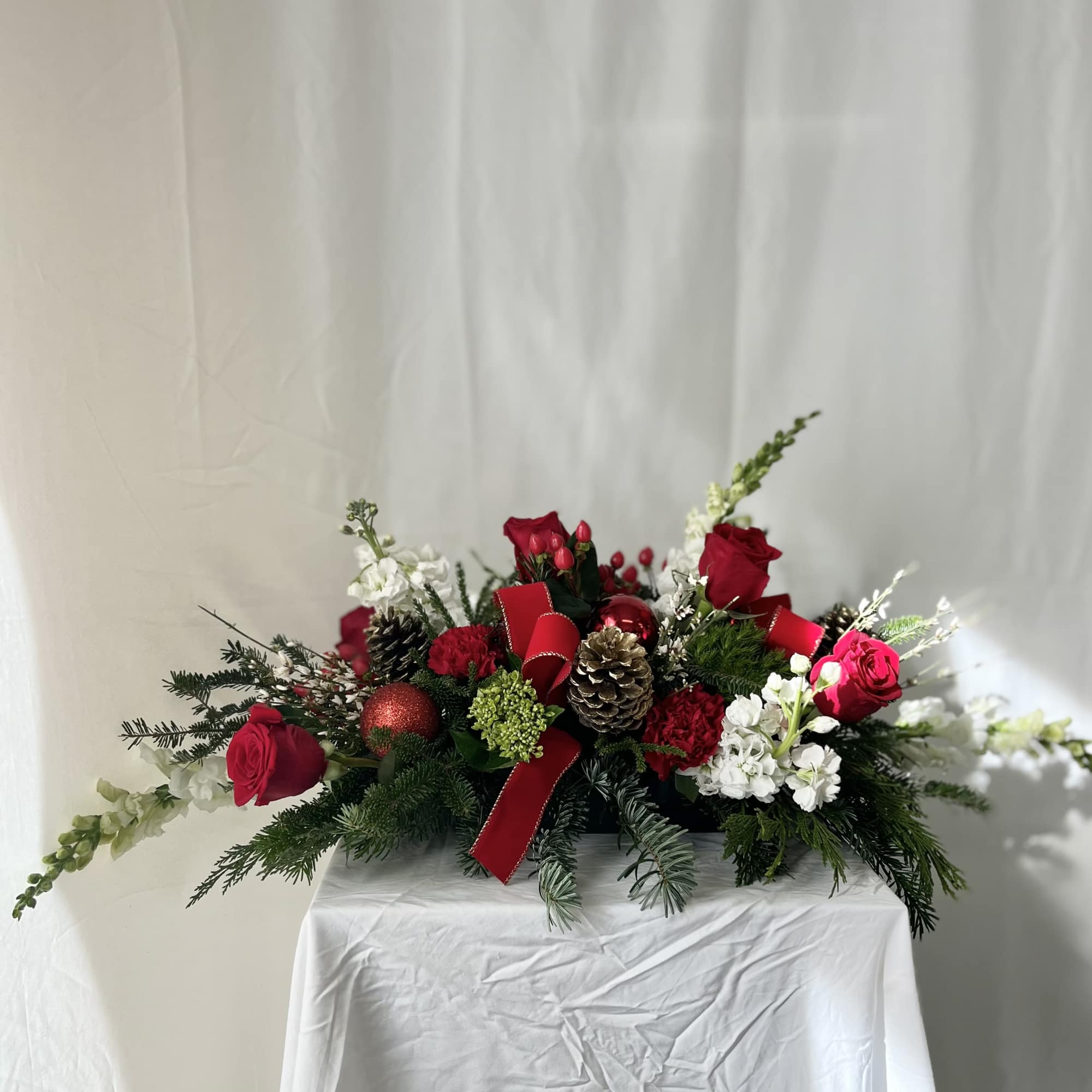 Bring holiday magic to life with this beautiful centerpiece! Red and white