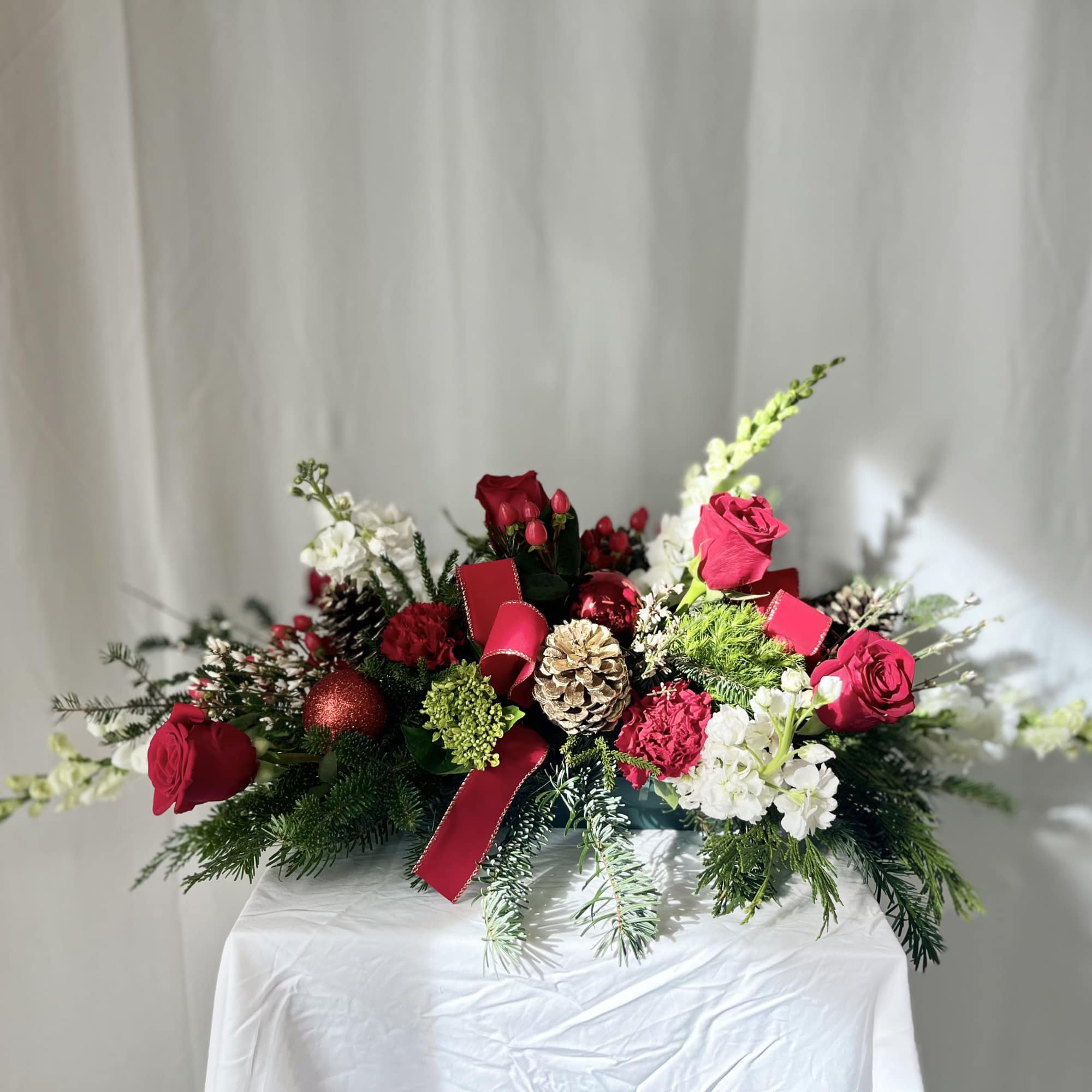 Bring holiday magic to life with this beautiful centerpiece! Red and white