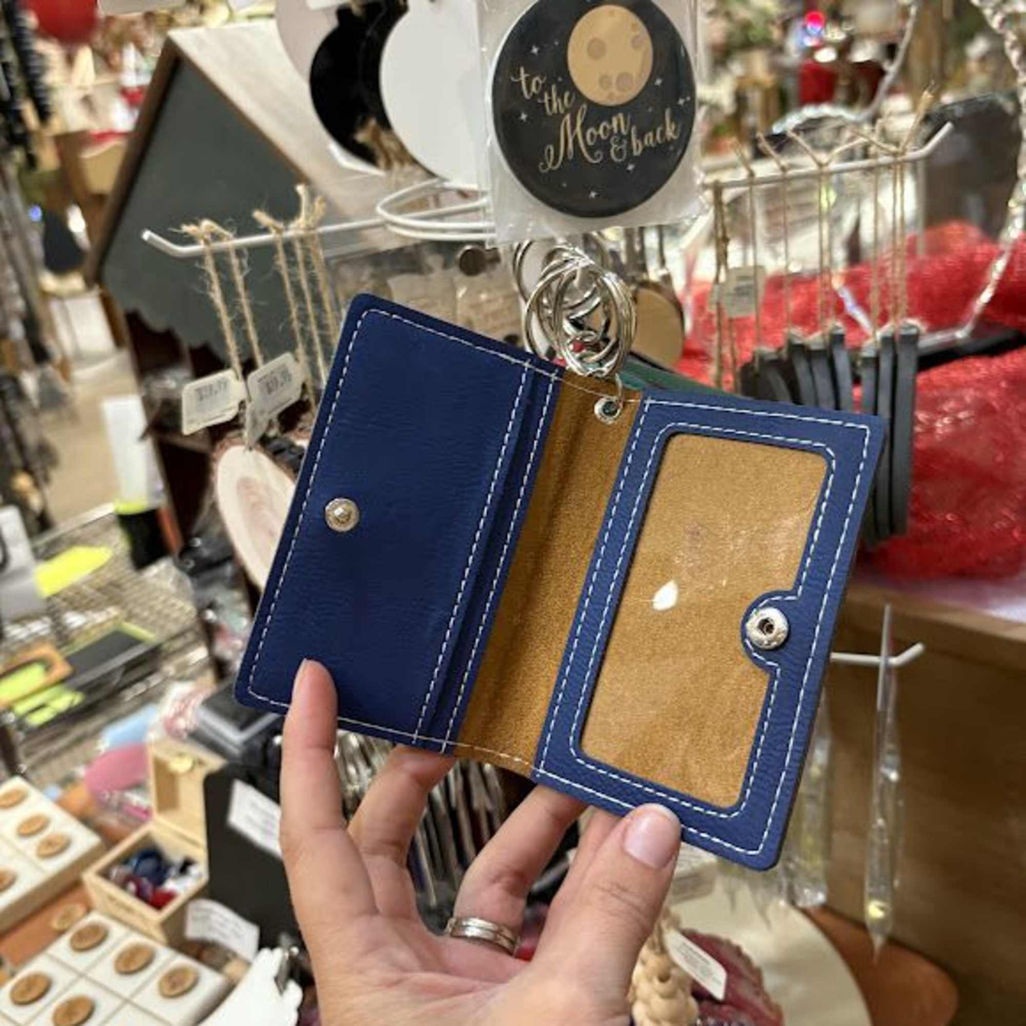 One pocket on outside of holder, measures 4" x 2 1/4".
ID Holder