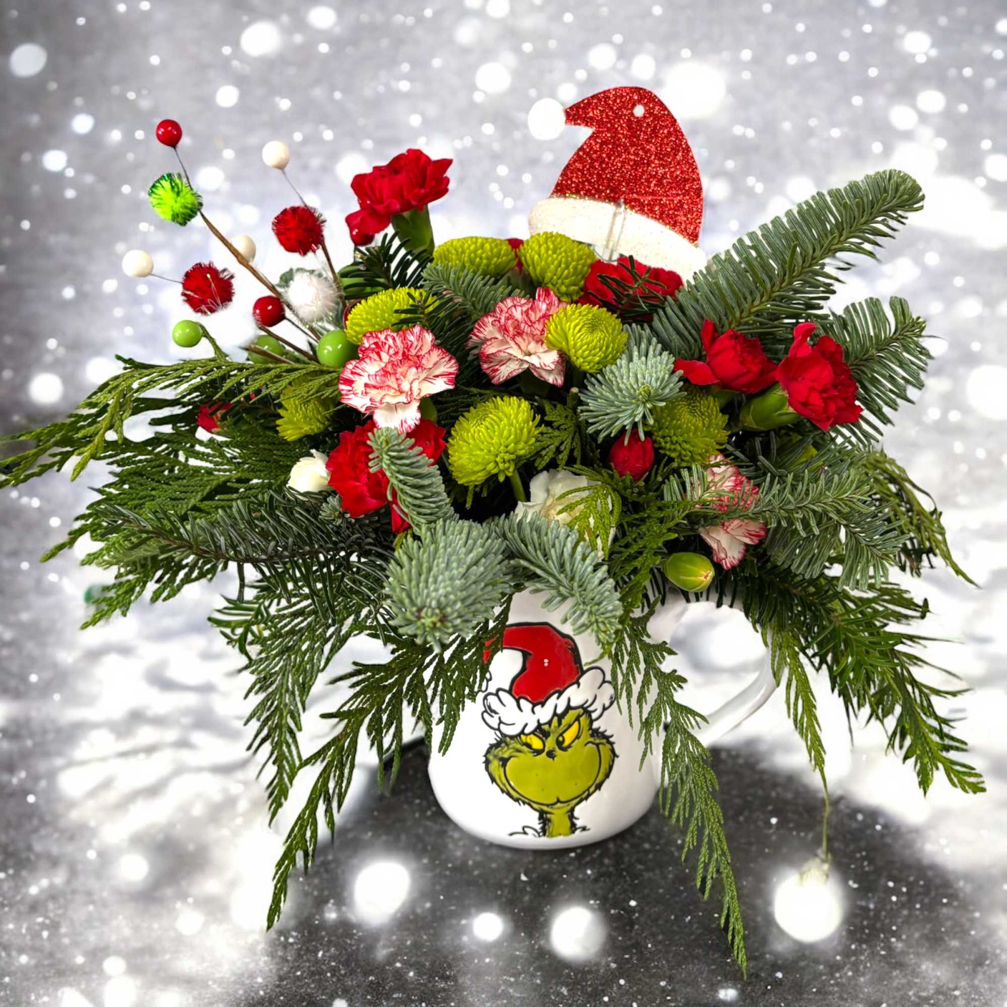 Wish someone a Merry Grinchmas with this fun keepsake mug arrangement.

Featuring a