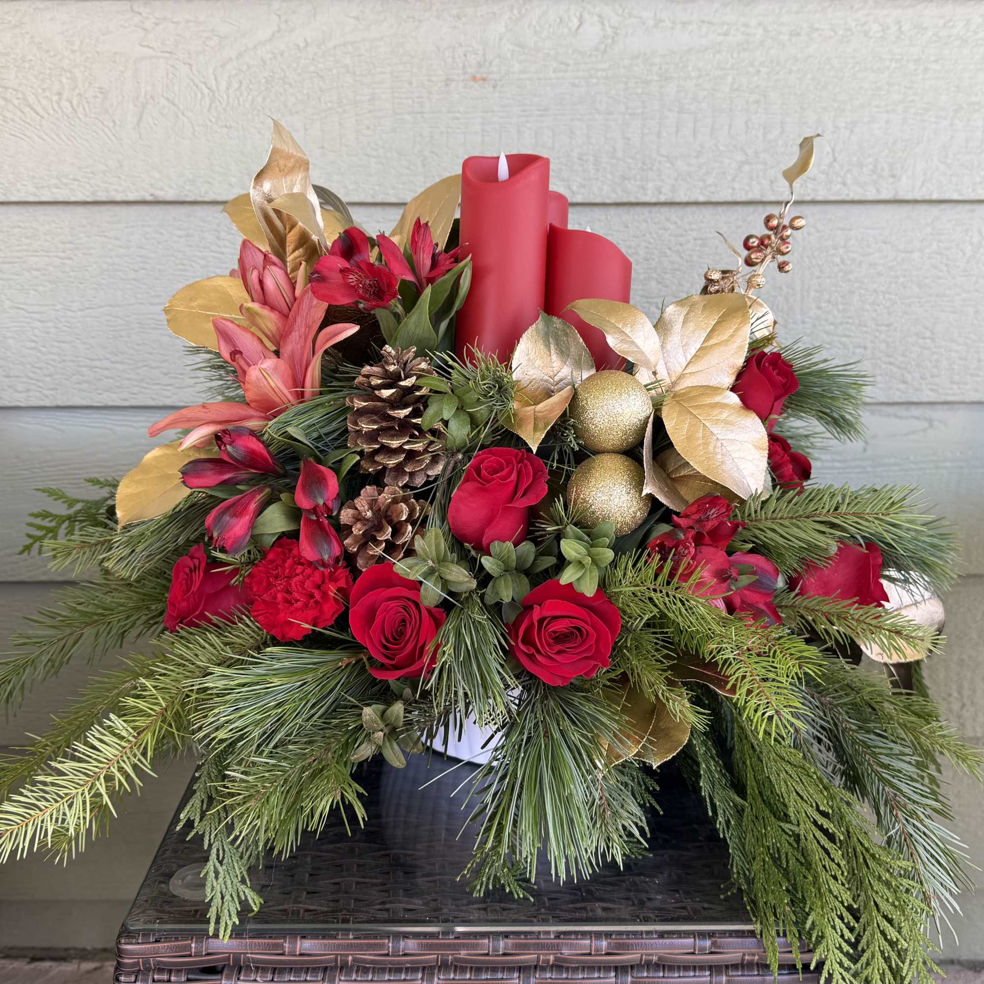 Celebrate the season with this lush holiday centerpiece, artfully designed with fresh