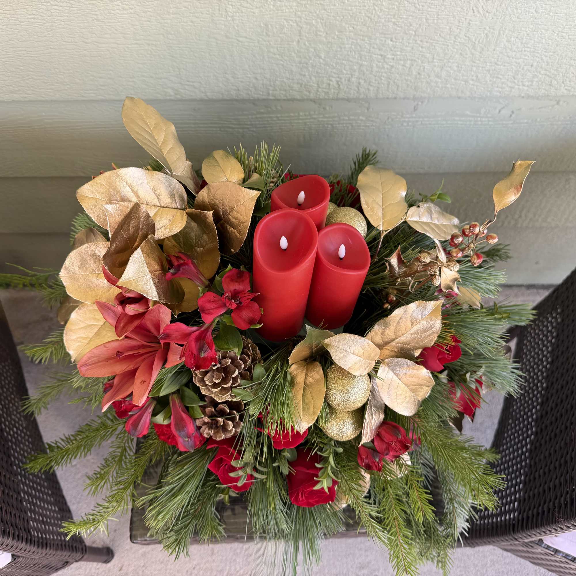 Celebrate the season with this lush holiday centerpiece, artfully designed with fresh