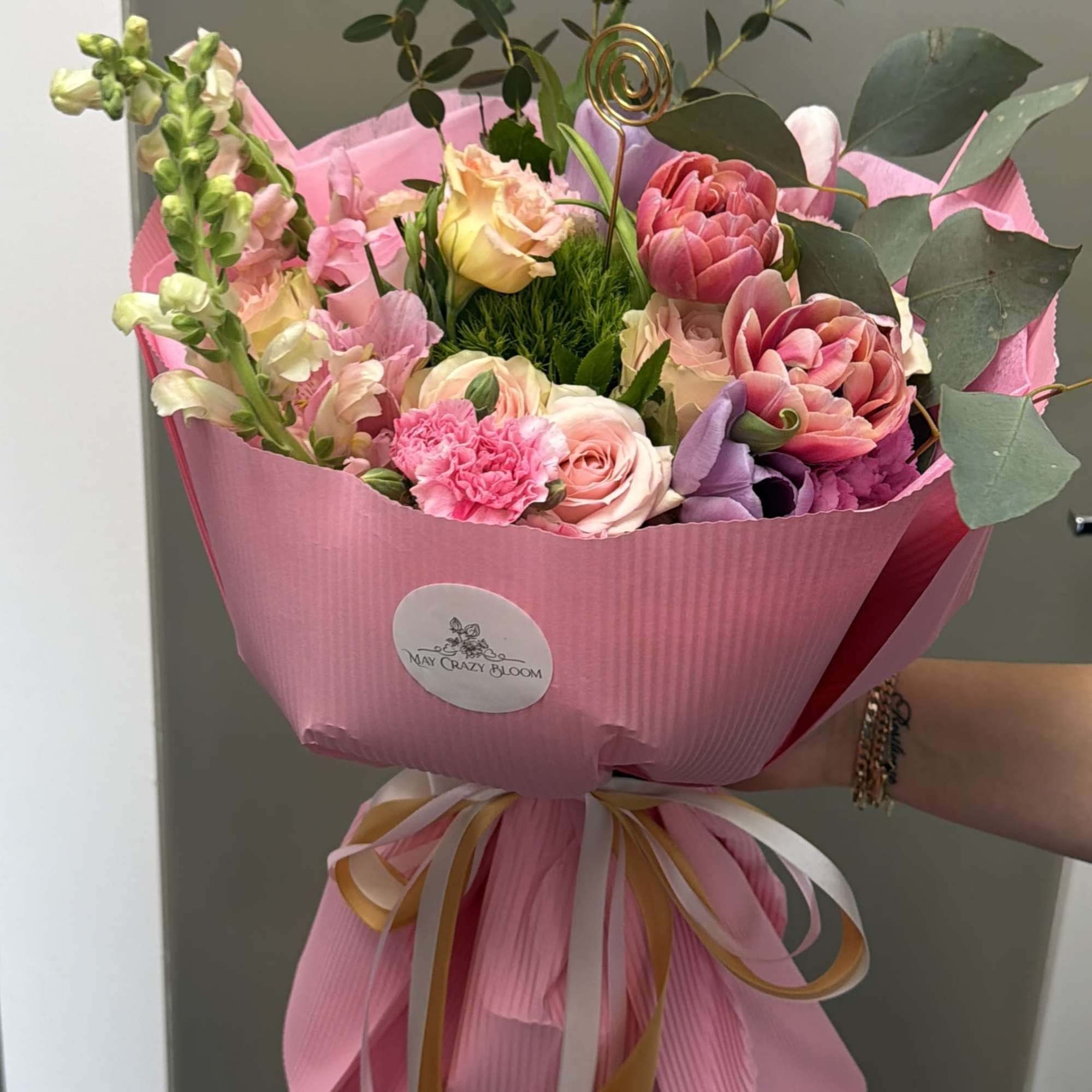 This enchanting hand-tied bouquet is a celebration of softness, romance, and natural