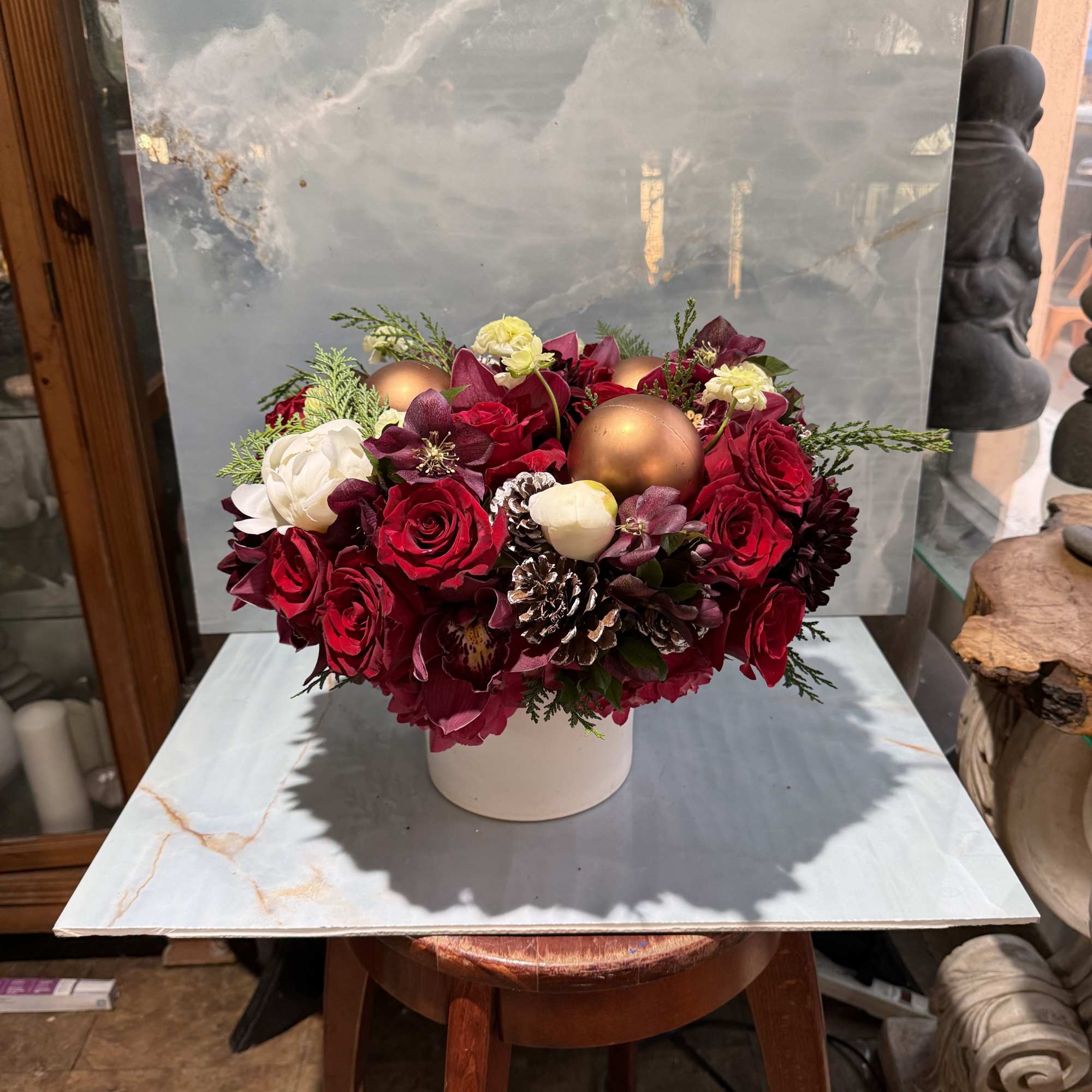 This arrangement is a lush, dramatic and seasonal Christmas Style arrangement with