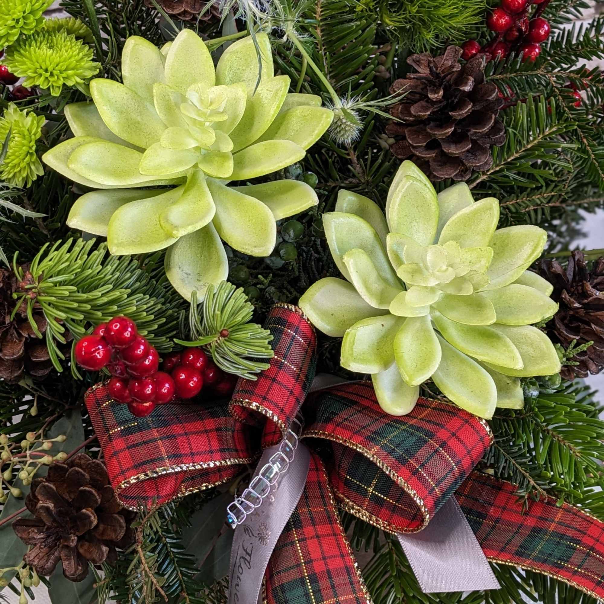 This festive arrangement is a cheerful celebration of winter charm and holiday