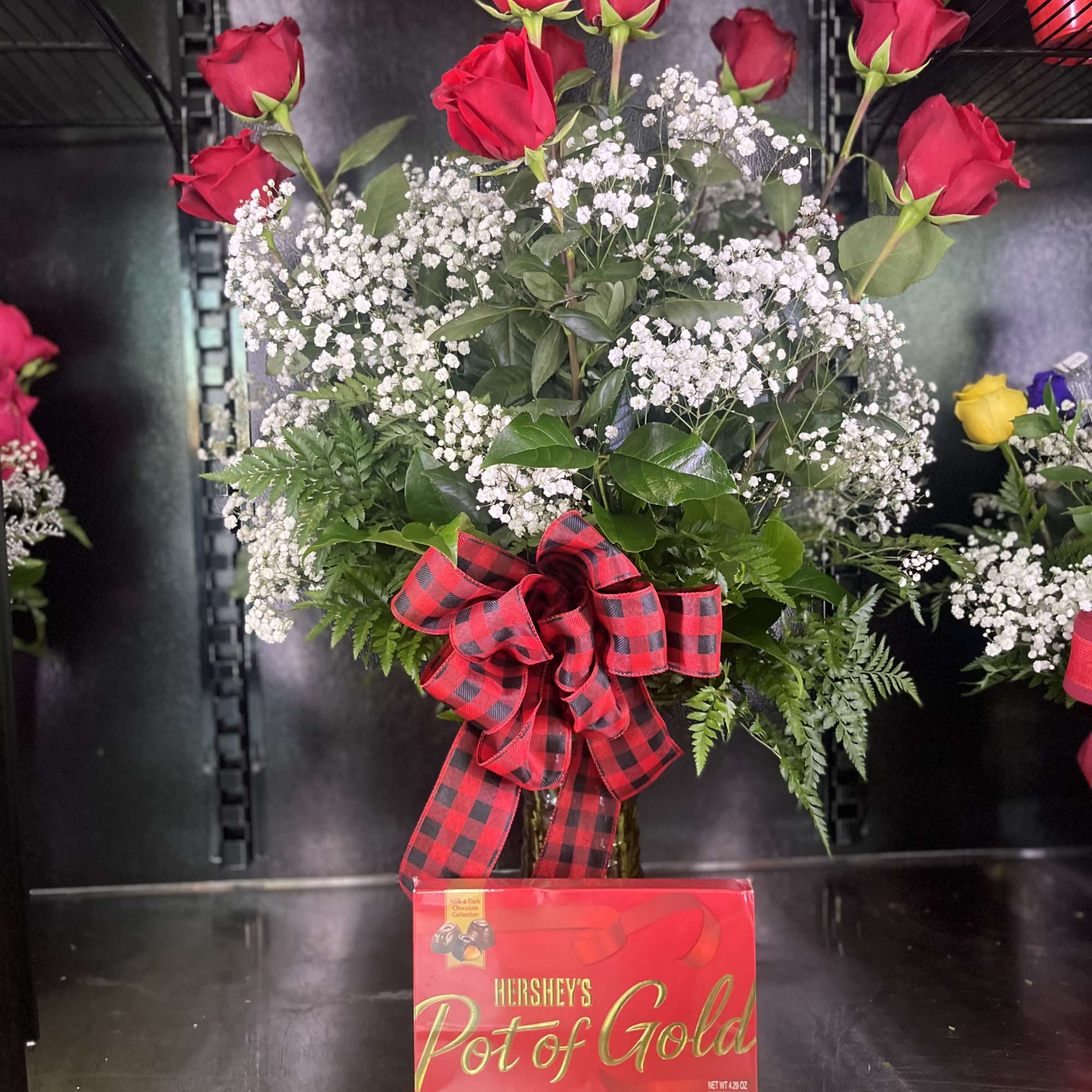box of Hersheys chocolate with 12 roses in vase 