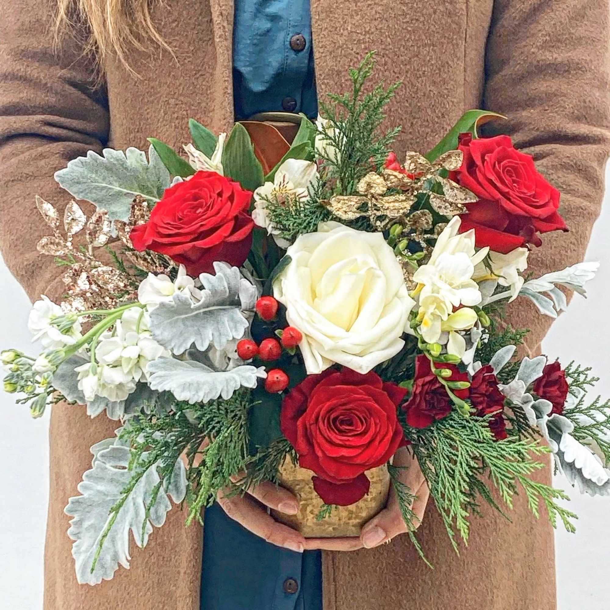 The Winter Charm is a petite yet striking arrangement that captures the
